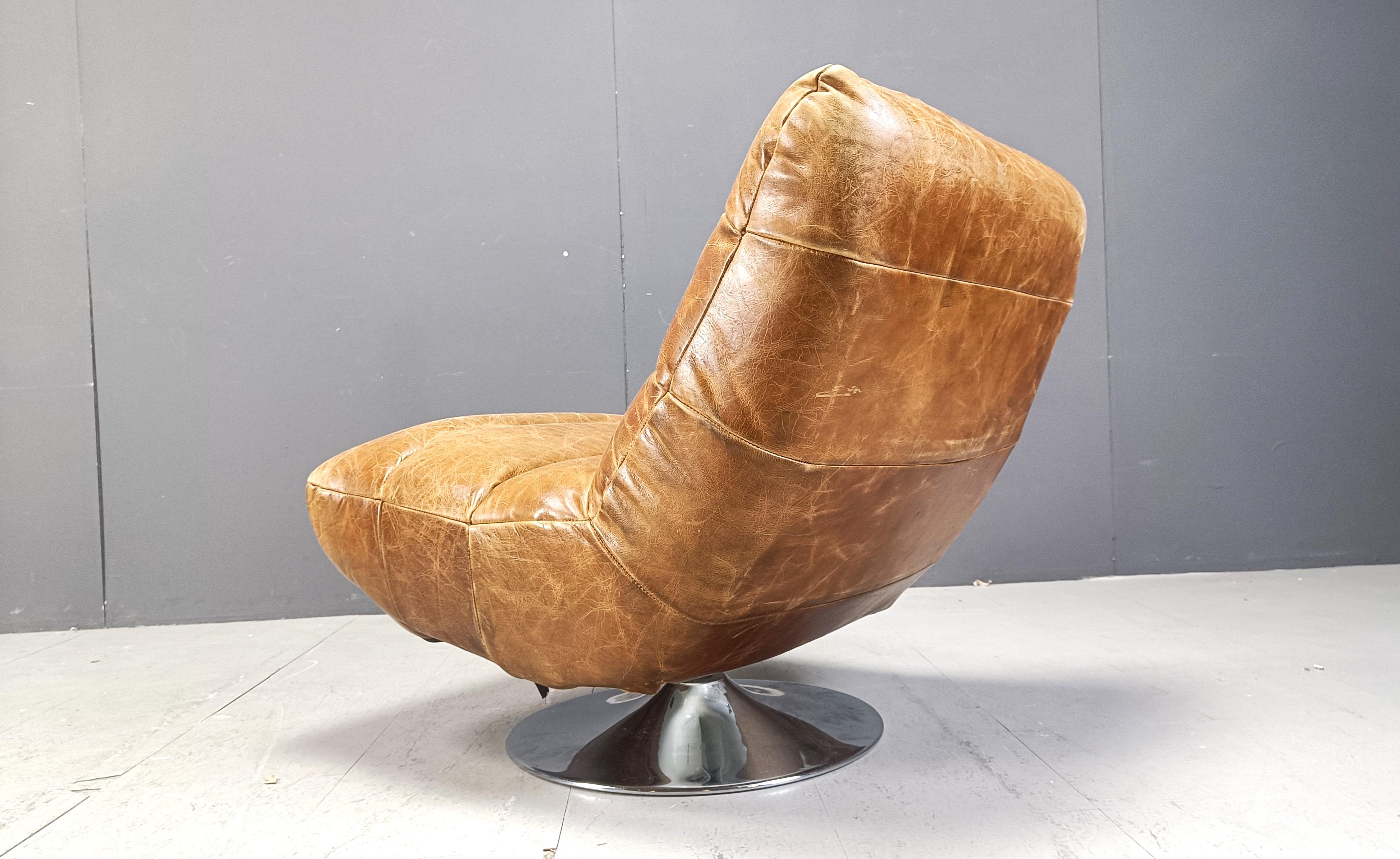 Vintage leather swivel chair with stool, 1970s For Sale 1