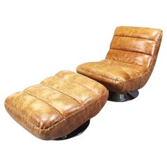 Vintage leather swivel chair with stool, 1970s