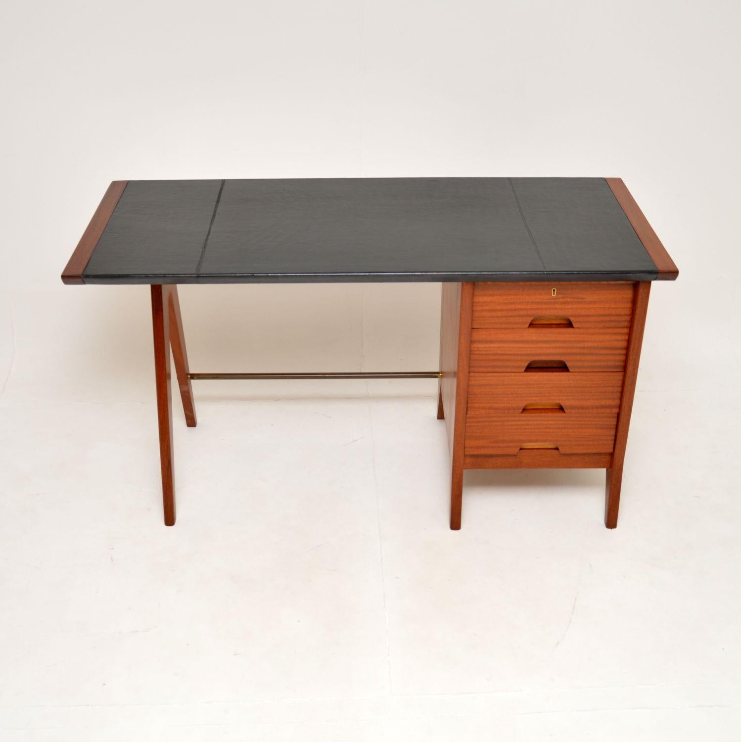 A stunning and very rare vintage leather top desk by Beresford and Hicks. This was made in England, it dates from the 1950-60’s. Beresford and Hicks were manufacturers of extremely high quality furniture, they made very limited amounts, this is a