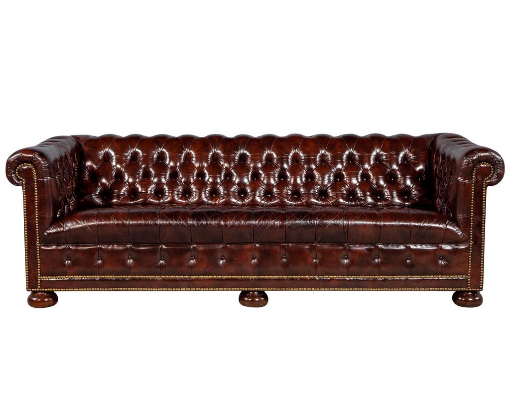 Vintage leather Tufted Chesterfield sofa. Vintage Sheaffer Chesterfield, upholstered in burgundy tufted leather with brass studded detail, in excellent original condition.