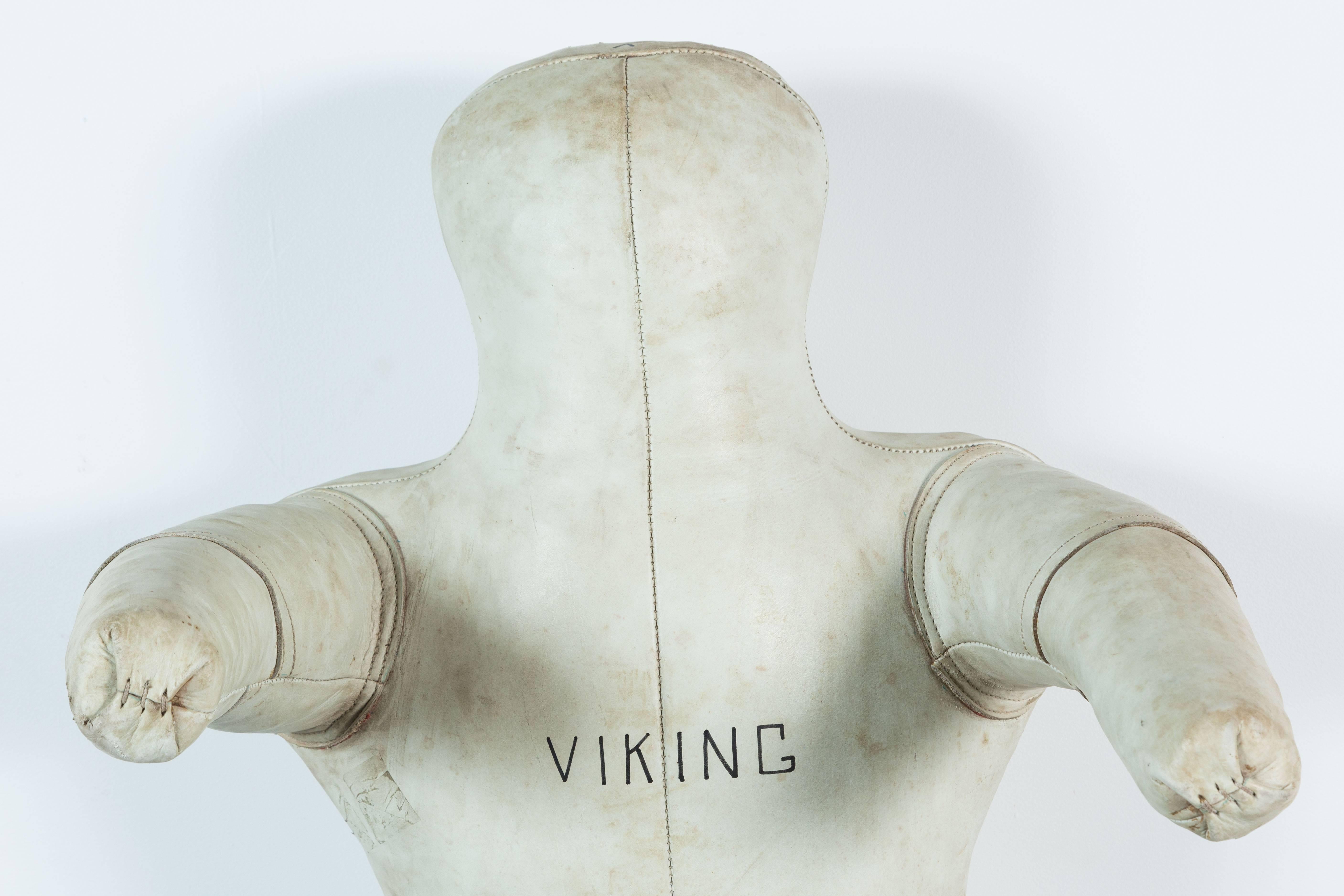 Great simple human form. Vintage Viking white leather gym wrestling dummy. This guy is solid. Nicely worn leather. Team Viking on front and makers identification on reverse.