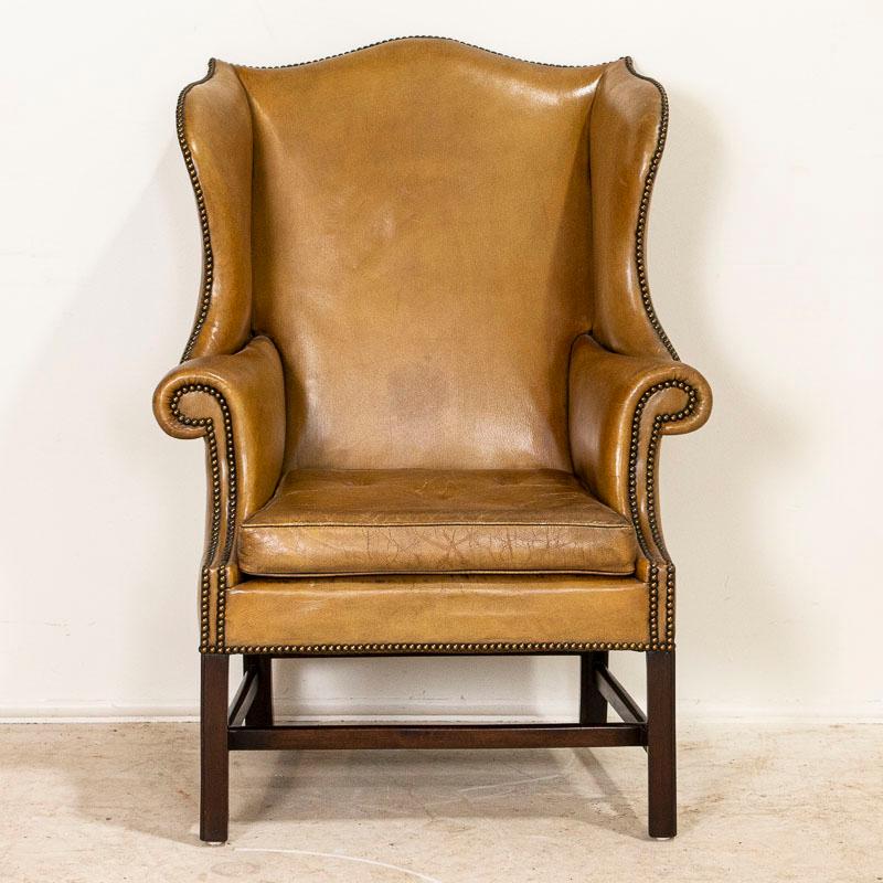 Whether you are ready to read a good book or smoke a cigar, this chair invites one to sit back, relax and reflect. The 1940's era still lingers here, and beckons to you as well. This handsome wingback chair is in well-kept original condition and