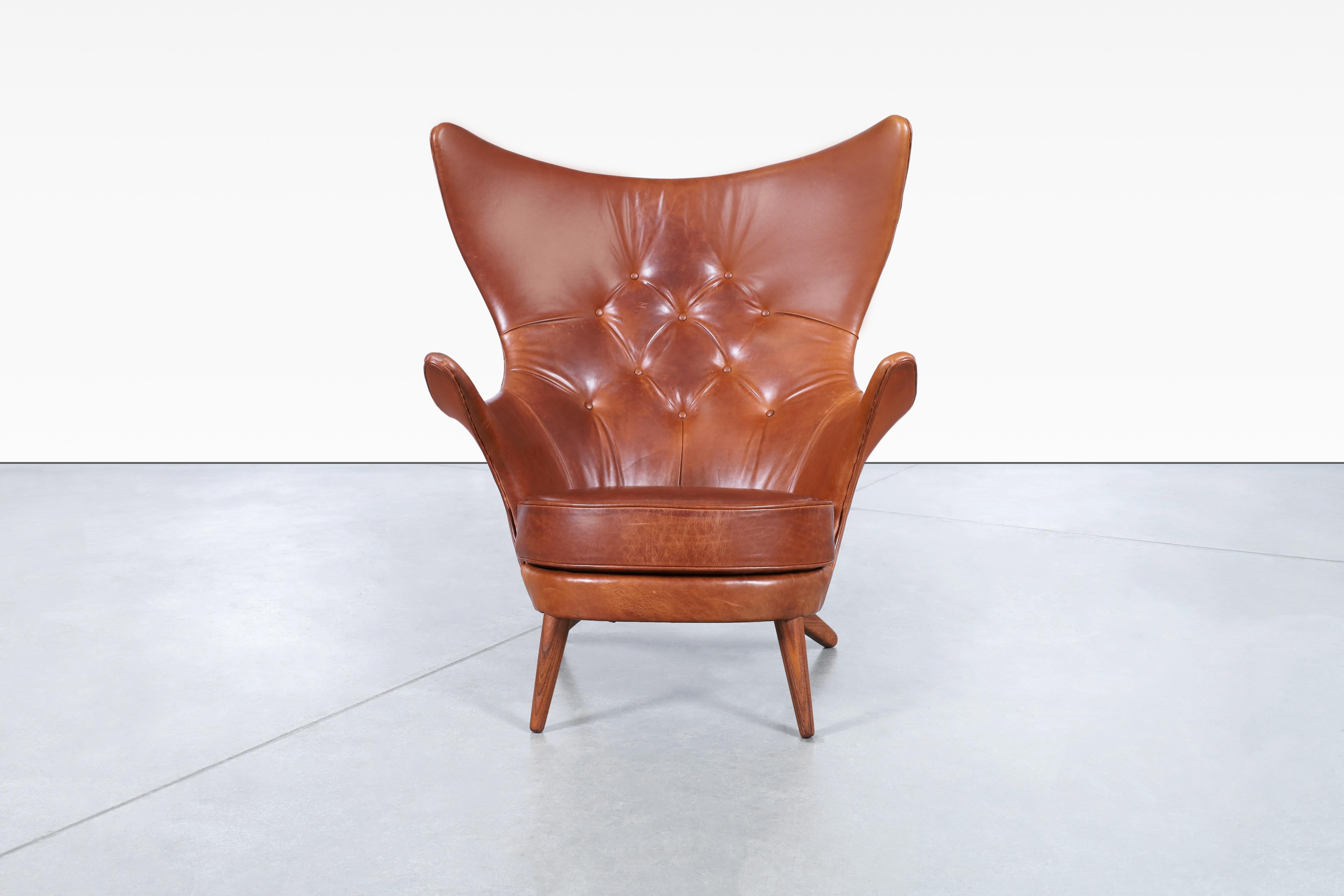 Amazing vintage leather wingback lounge chair designed by Kai Bruun for Sesam Møbler in Denmark, circa 1960s. This chair, also known as Siesta, is a true testament to the art of furniture making, featuring the finest high-quality Italian leather and