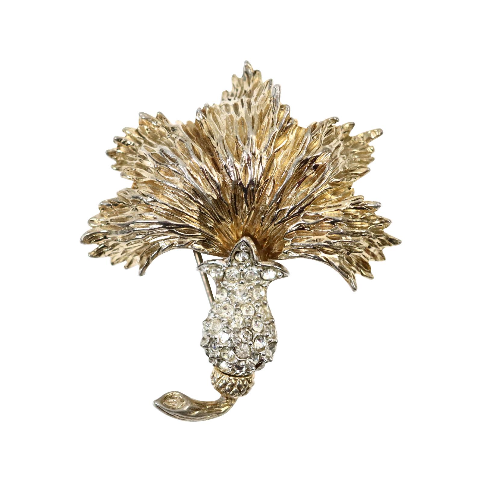 Vintage Ledo Gold Tone with Diamante Leaf Brooch Circa 1960s.  The leaf is front facing and etched out and highly set with pave diamante at the bottom.   Earrings on site to match and also a bracelet from Ledo in this same family. I have Buccellati