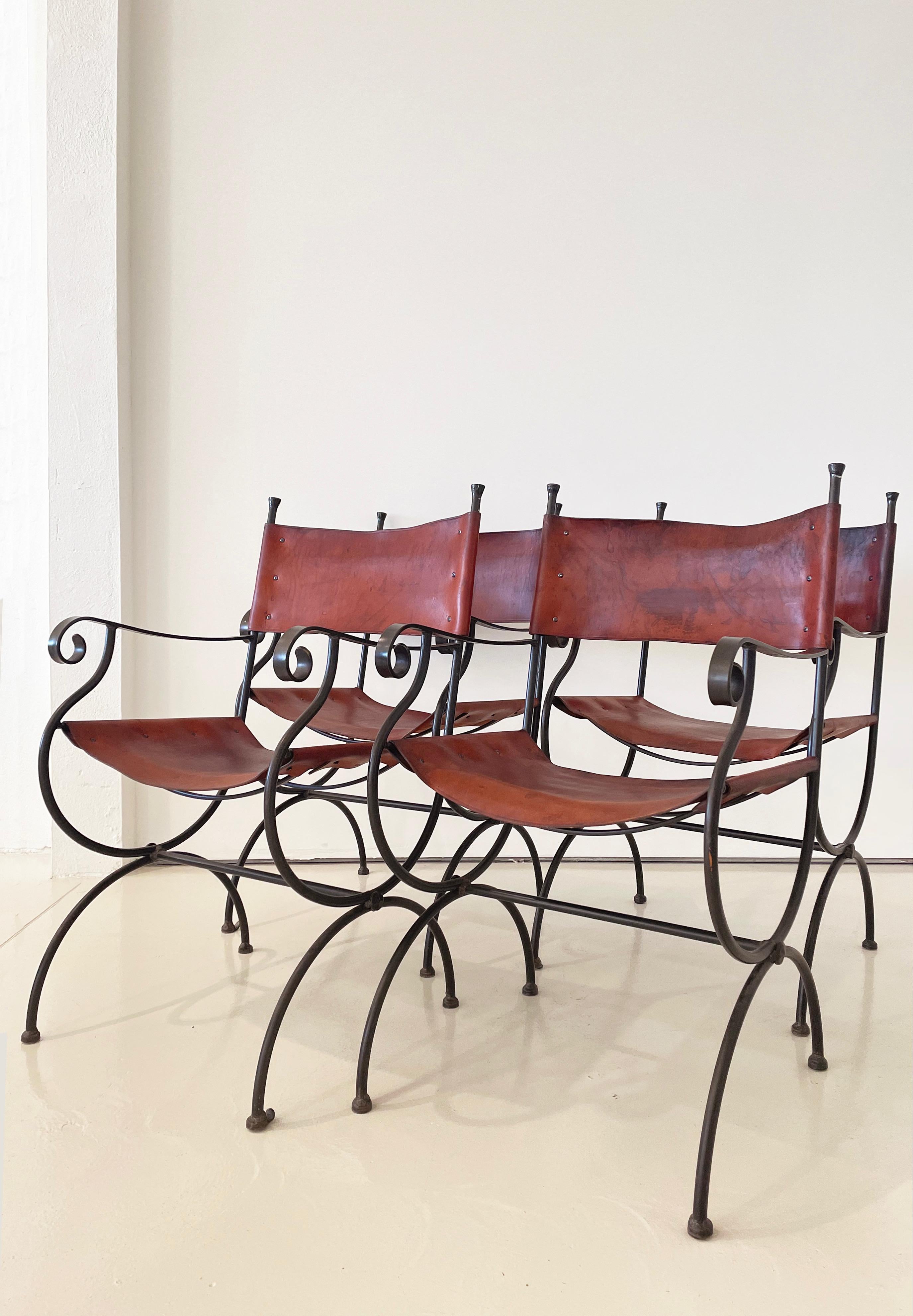 Legacy Collection captain dining chairs by Charleston Forge (original manufacturer)

Originally made in Tennessee

Produced between 1980s and early 2000s.

Solid, hand-forged and wrought iron frames

Original thick, belt leather sling back