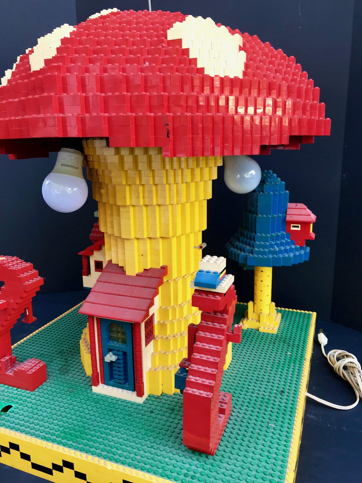 This exclusive sculpture was created and build by Lego architects solely for advertising purposes. This elaborate construction with hundreds of pieces is glued together. This mushroom lamp is not only one of the top Lego creations it is also one of