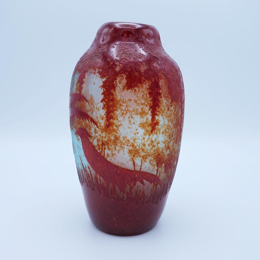 Offering this vintage Legras “Pheasants” Art Deco art glass cameo relief vase. This acid etched cameo vase has a pheasant and fauna design in mottled deep red against a slightly blue tinted clear background. Vase is acid etched, signed within the