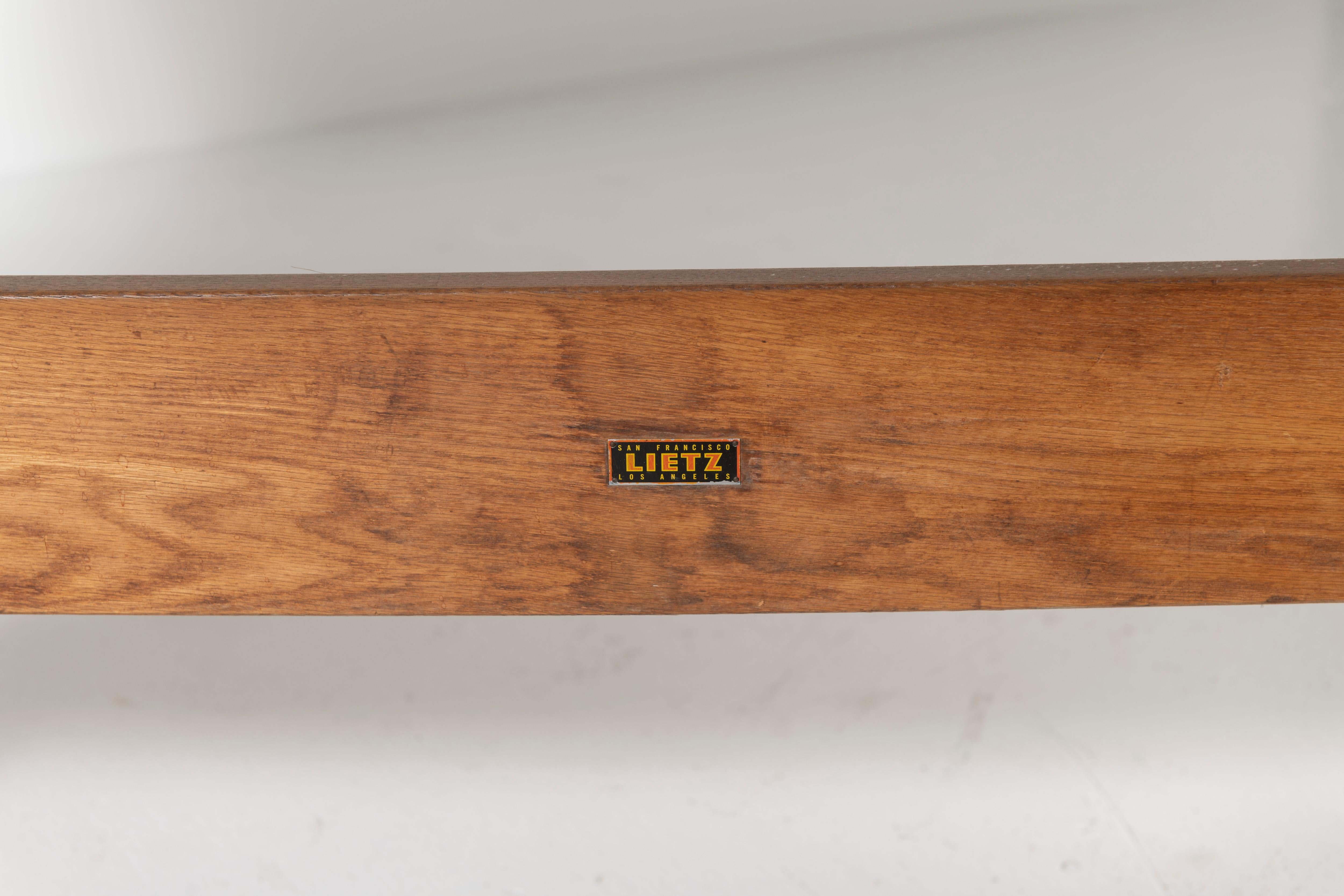 Crafted in San Francisco in the 1940s, this vintage Lietz drafting table is made of maple and cast iron base. The table is conveniently adjustable and functional.  
Original label is present and the table is in good condition, could be enhanced with