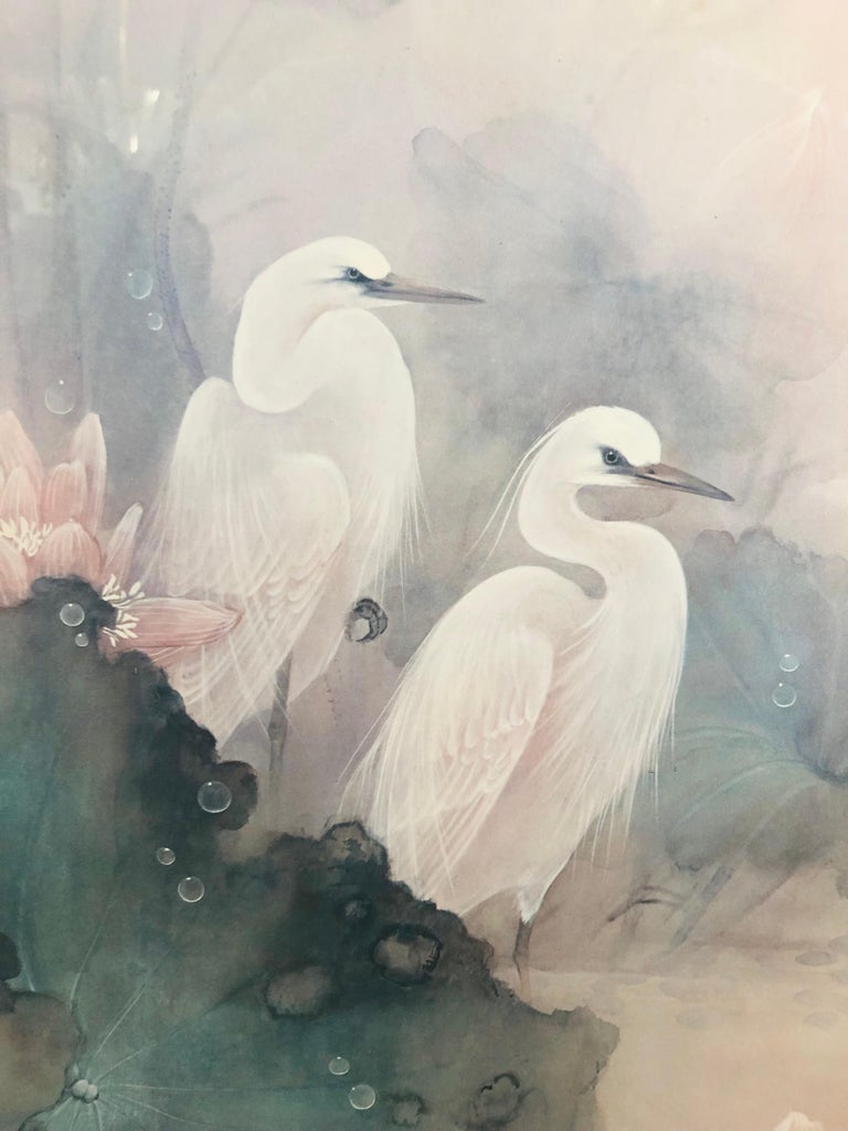 A beautiful print by Lena Liu (Taiwan, 1951) depicting herons and flowers in a light blue and pink tone colors. The print is signed and numbered as well as finely presented in custom gold frame with glass top and matting. 

About the artist: