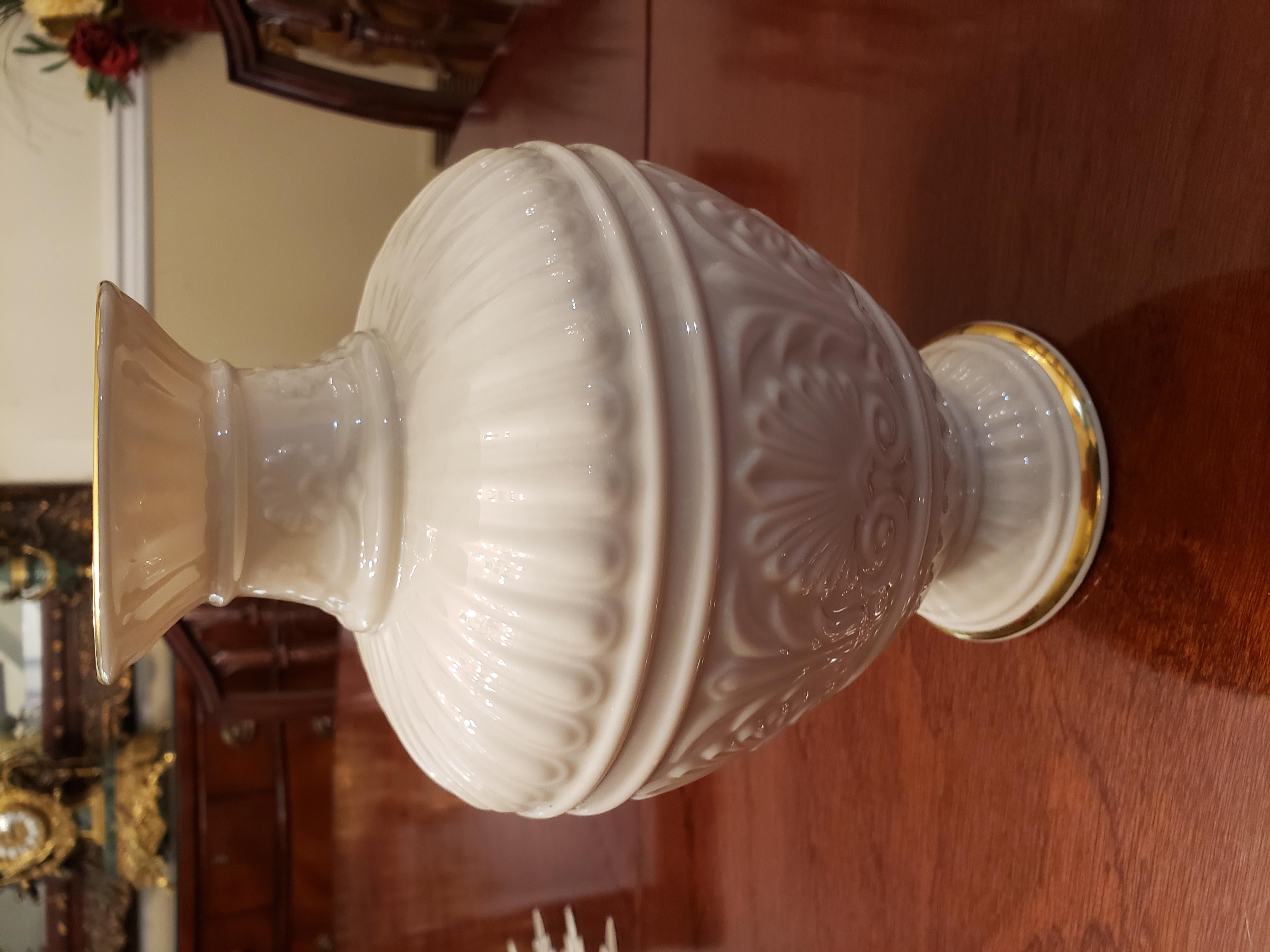 This is a very nice Lenox China vase in the Athenian pattern. Also made in U.S.A. so it is Vintage Lenox. This vase measures 9 1/2 inches high, 3 3/4 at the base and 6 inches at the widest depth 3.25