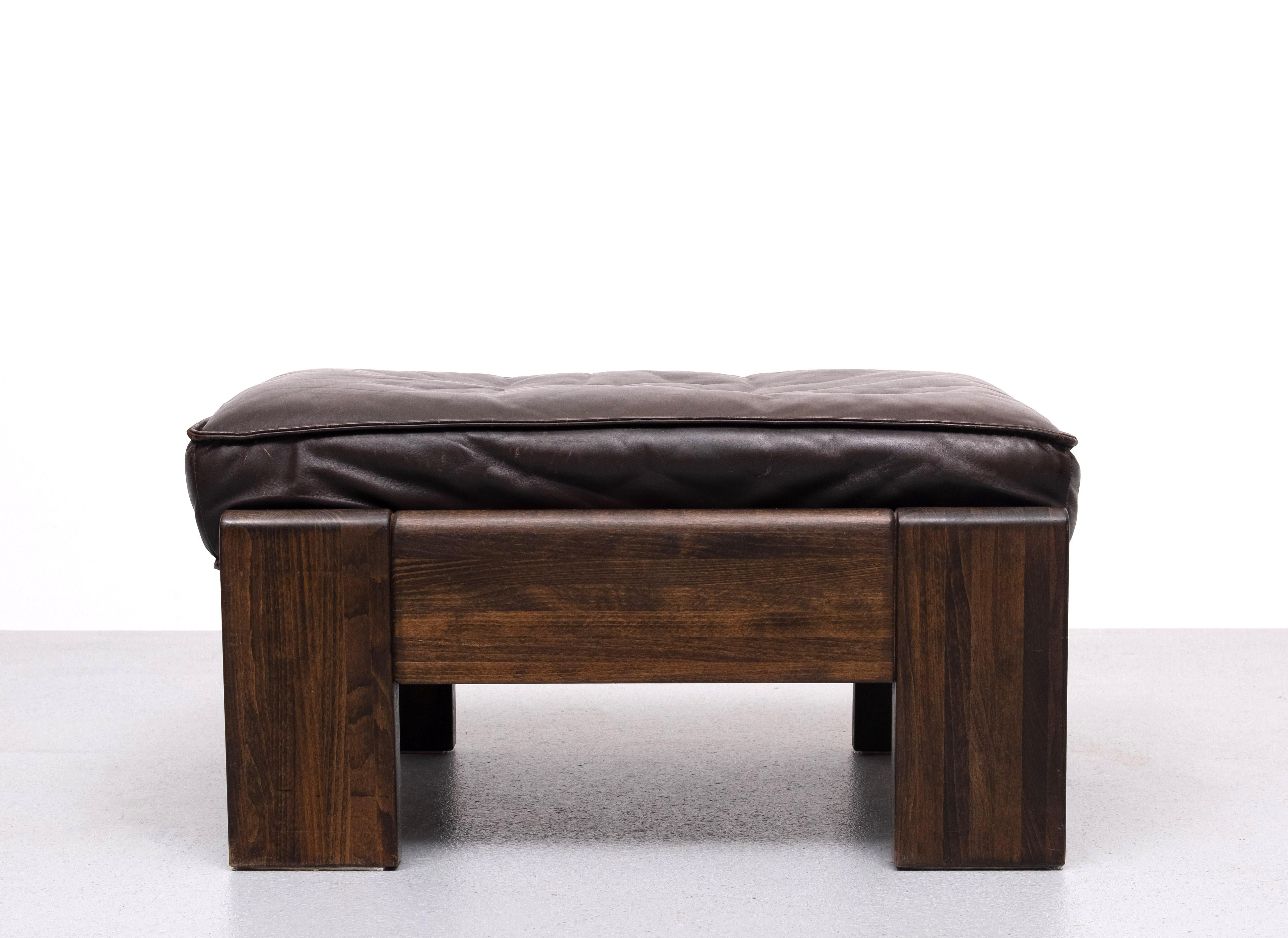 Very nice robust Ottoman or Pouf .Manufactured by Leolux 
Beautiful smooth Brown Leather upholstery . Solid Oak frame .                 Good quality piece . Heavy . on destructible . 