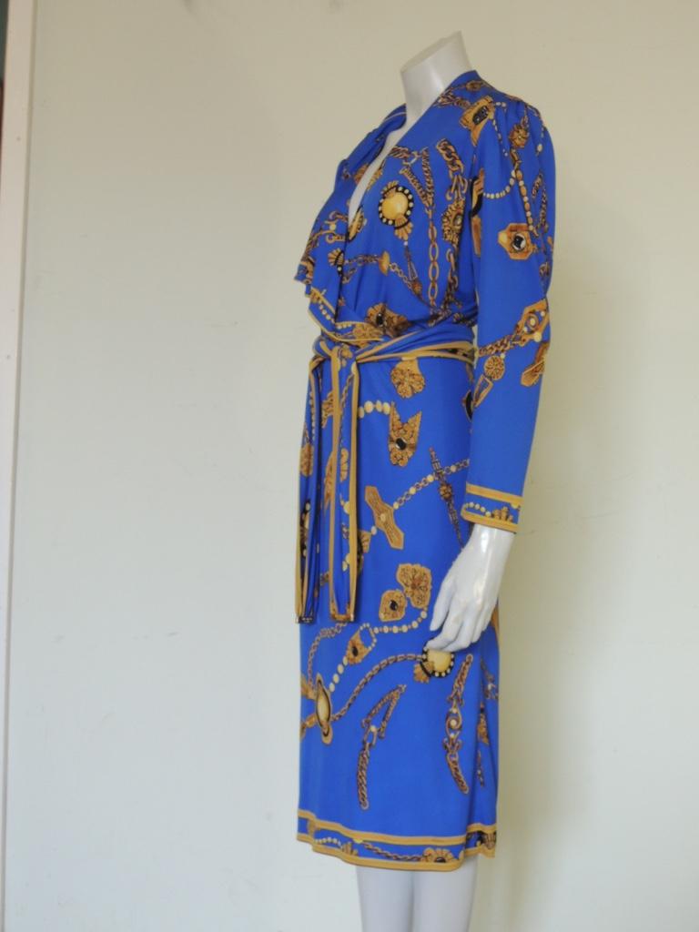 This is a vintage Leonard Studio wrap dress in blue silk jersey mikado. Made in Italy. This appears to be 1980s era.

The dress is tagged size 2.

This dress is in good pre-owned vintage condition. There are no holes or runs in the dress, the fabric