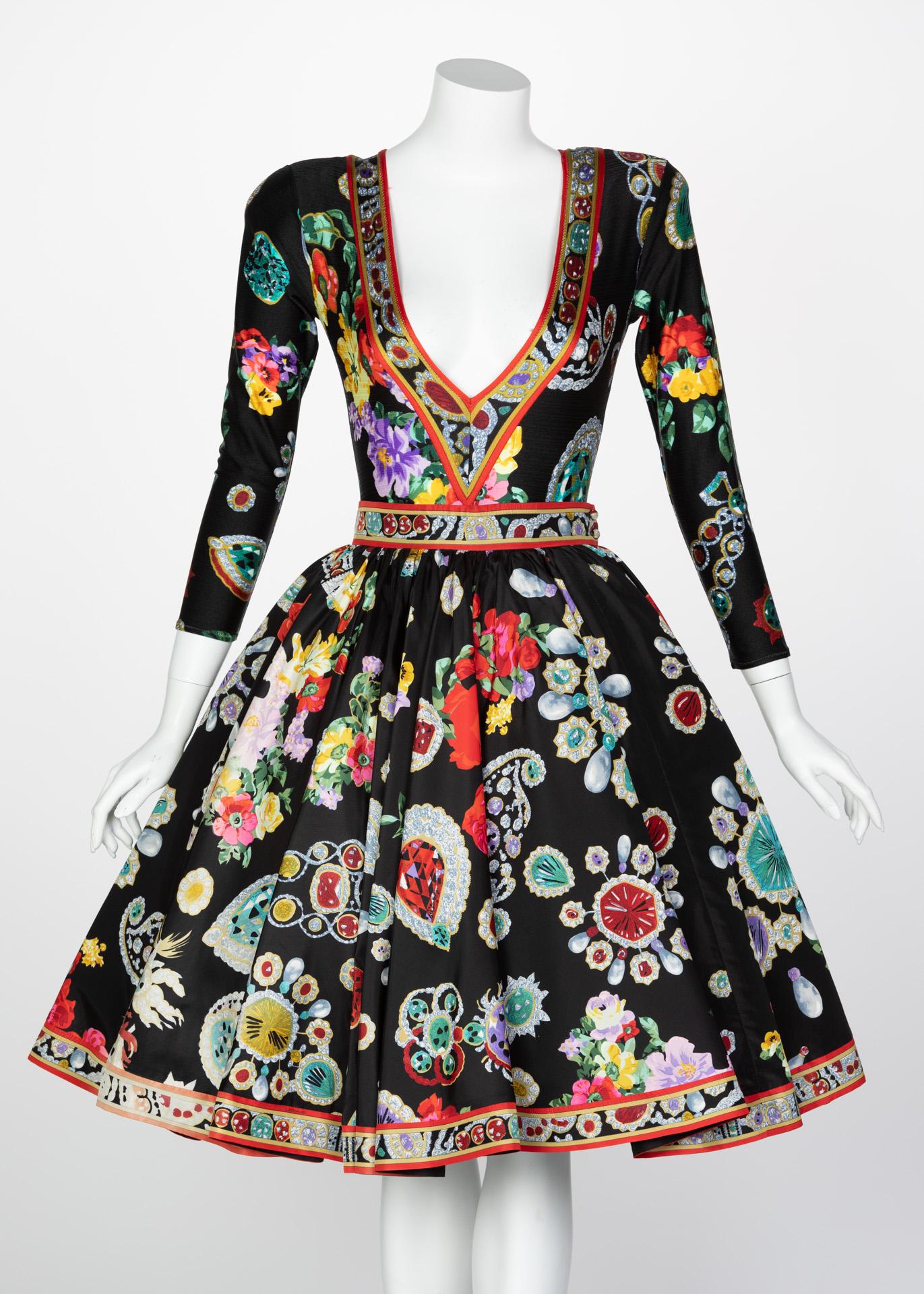 Exceptionally balanced with rich hues and a field of black, this vintage Leonard dress ensemble is an artisanal work of art. Typically using less figurative prints, this bodysuit and skirt use a jewel and floral print with vivid reds, yellows,