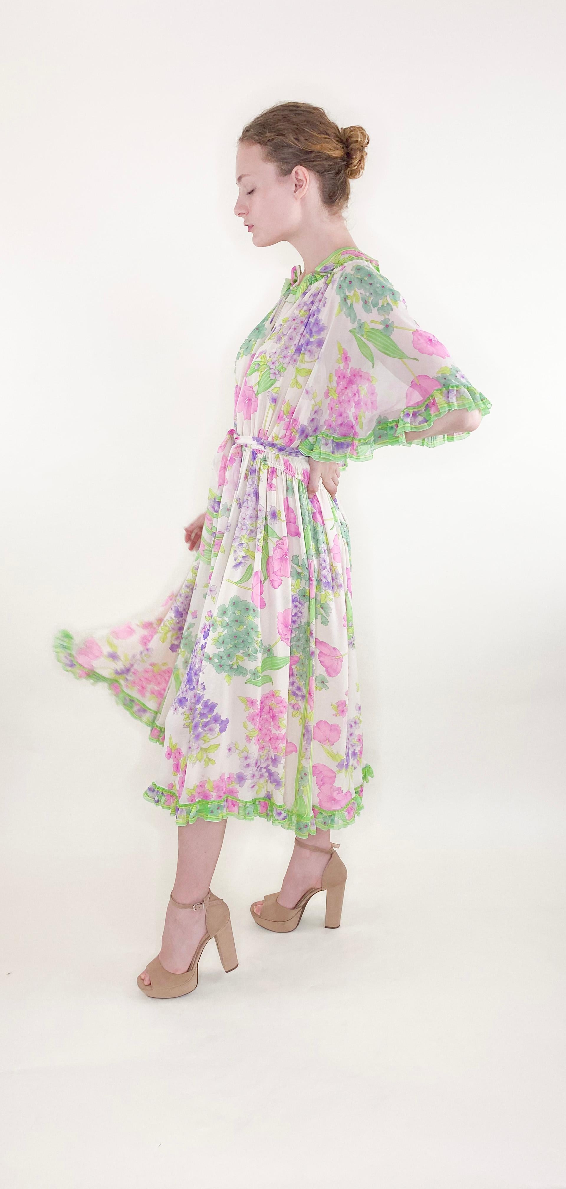Get ready to turn heads in this flowy Leonard Silk Chiffon Floral Dress! With its ruffled sleeves and midi length, this dress is both flirty and elegant. The colorful print is perfect for any summer occasion. Make a statement and stand out from the