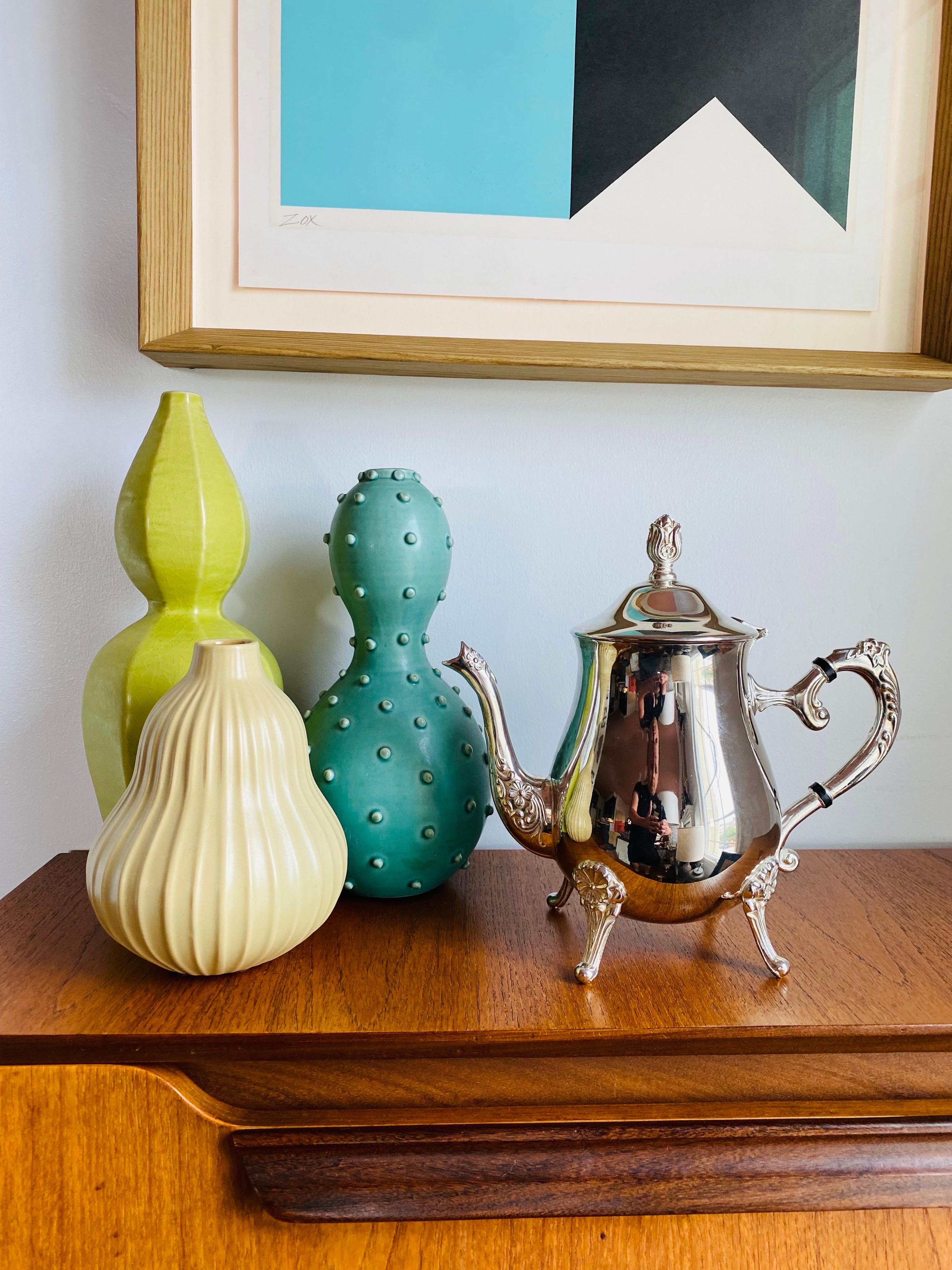 Beautiful and collectable, this silver plated tea or coffee pot adds style and glamour to modern and eclectic styles. Ornate and simple lines merge to bring shine and style to modern times from a classical era. Stylish and elegant.


Mid-Century,