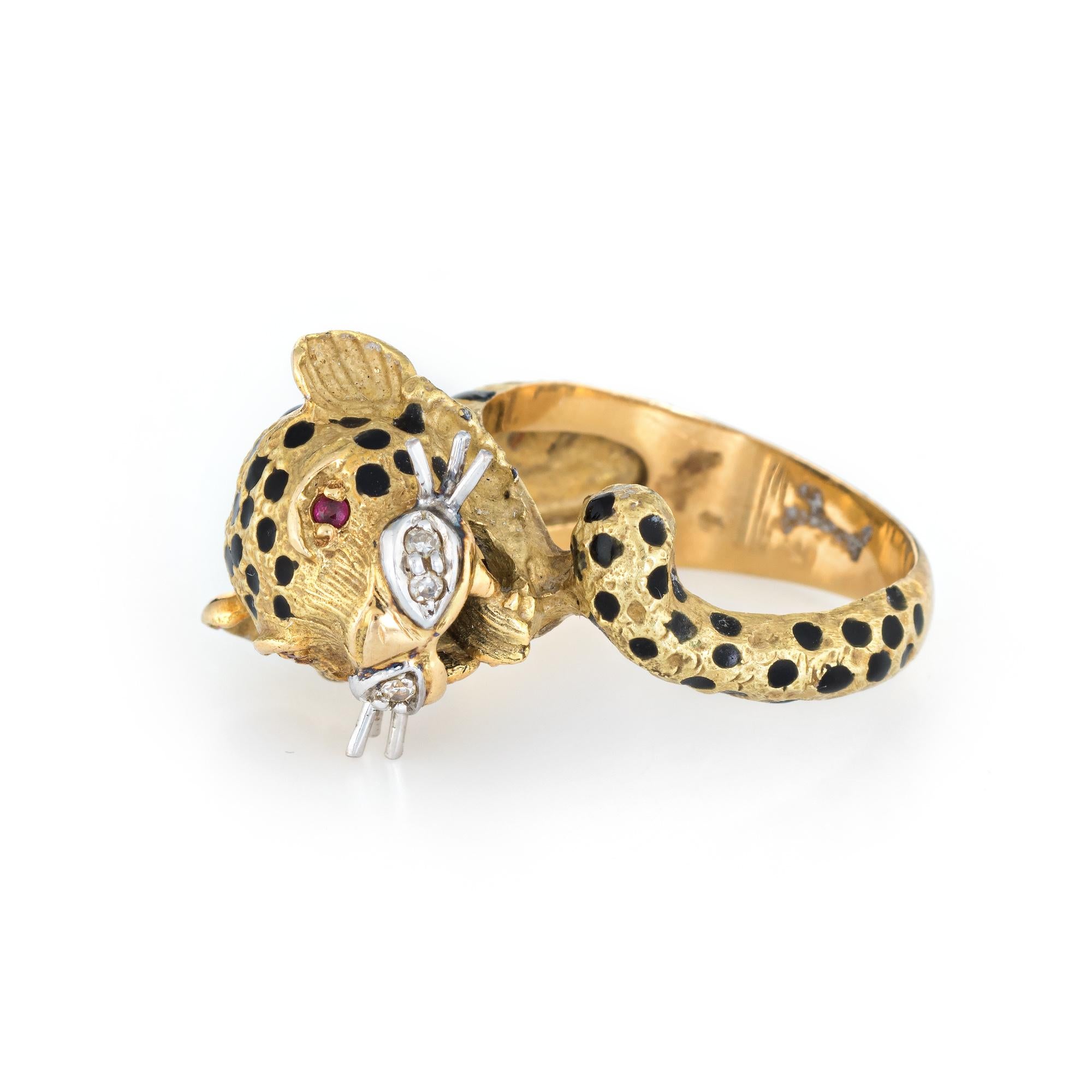 Finely detailed vintage leopard ring (circa 1960s to 1970s) crafted in 18 karat yellow gold. 

Diamonds total an estimated 0.02 carats (estimated at H-I color and SI2 clarity), accented with an estimated 0.02 carats of rubies.  

The leopard