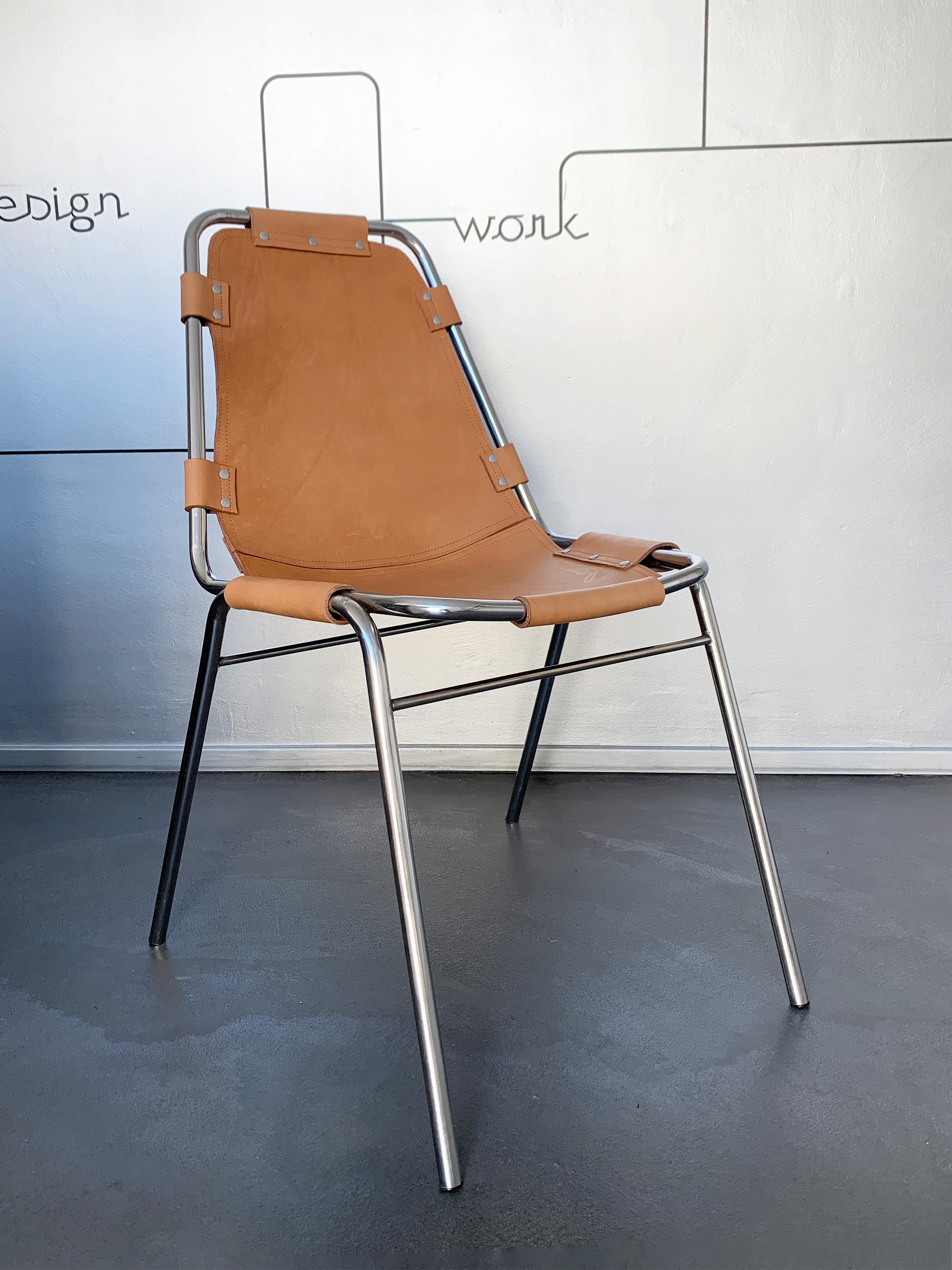 Dining chair commissioned / selected by Charlotte Perriand for the interior design of the appartements of 'Les Arcs' Ski Resorts in the French Alps.

Chromed tubular frame in metal with thick brown leather seat.

New handmade leather seat,