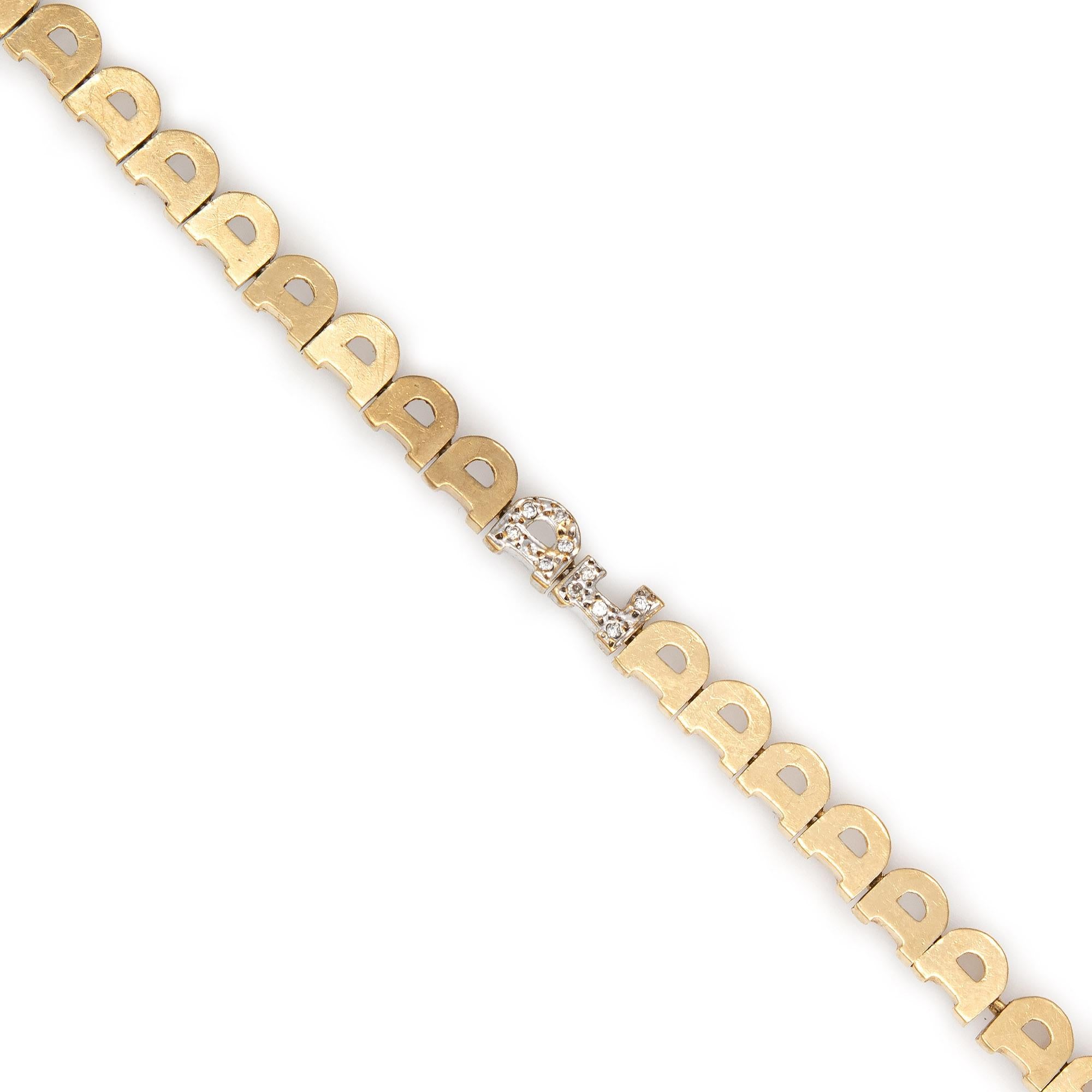 Stylish and finely detailed vintage letter 'D' diamond bracelet (circa 1970s to 1980s) crafted in 14k yellow gold. 

Diamonds total an estimated 0.11 carats (estimated at H-I color and SI1 clarity).   

The bracelet makes a great statement on the