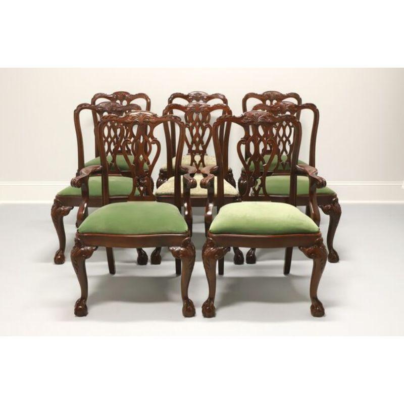 A set of eight dining chairs in the Chippendale style by Lexington. Mahogany with carved seatbacks, upholstered seats, cabriole legs with carved knees, and ball in claw feet. Six side chairs and two armchairs. Two of the six side chairs have a