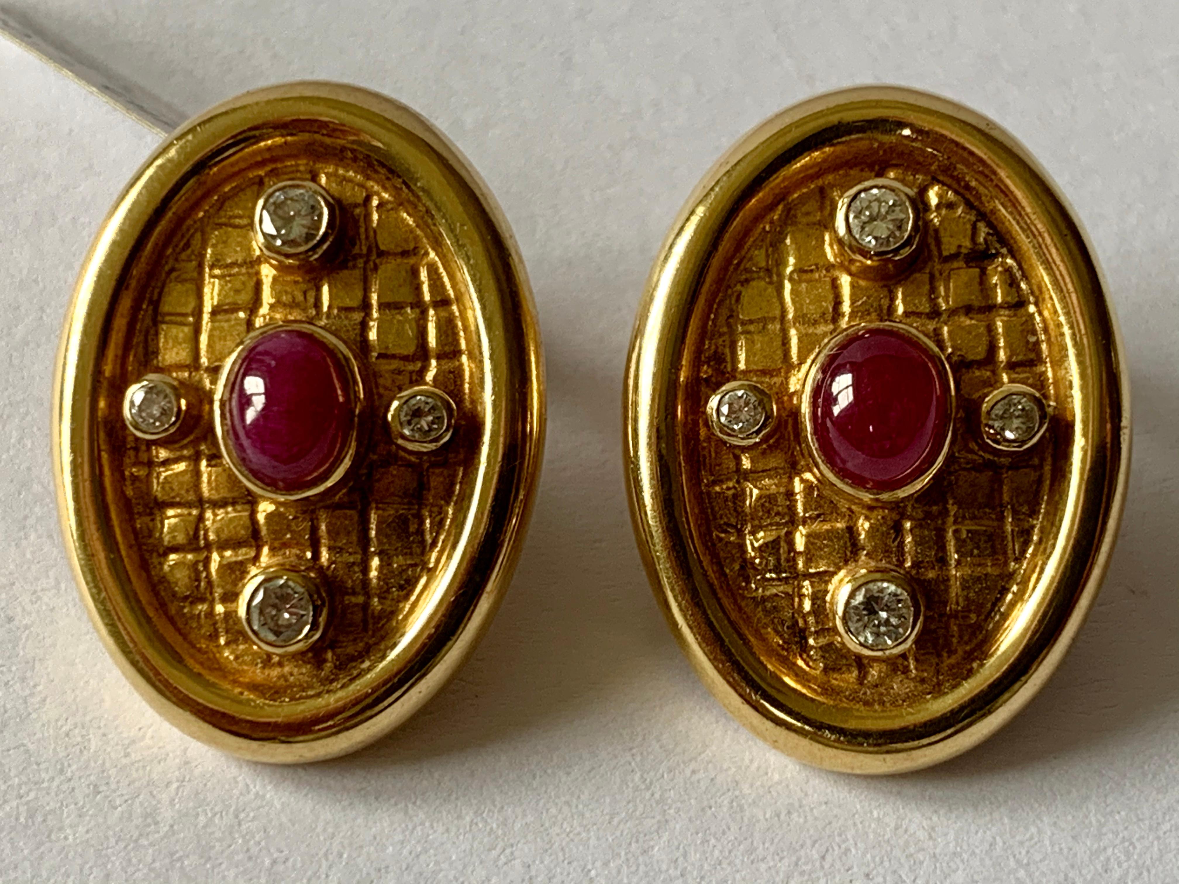 Lalaounis ear clips in 18 K Gold set with 2 Ruby Cabochons and 8 brilliant cut Diamonds.  They measure 2.50 cm by 1.60 cm . Stamped Lalaounis and gold marks. 
Authenticity and money back is guaranteed!