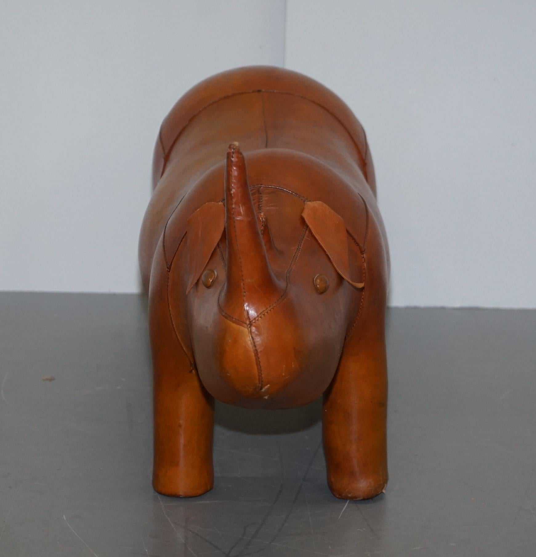 We are delighted to offer for sale this absolutely sublime original vintage Liberty’s London tan brown leather hand dyed Rhino footstool

These come in varying sizes there is a quite unpractical extra large size which is around a meter wide that’s