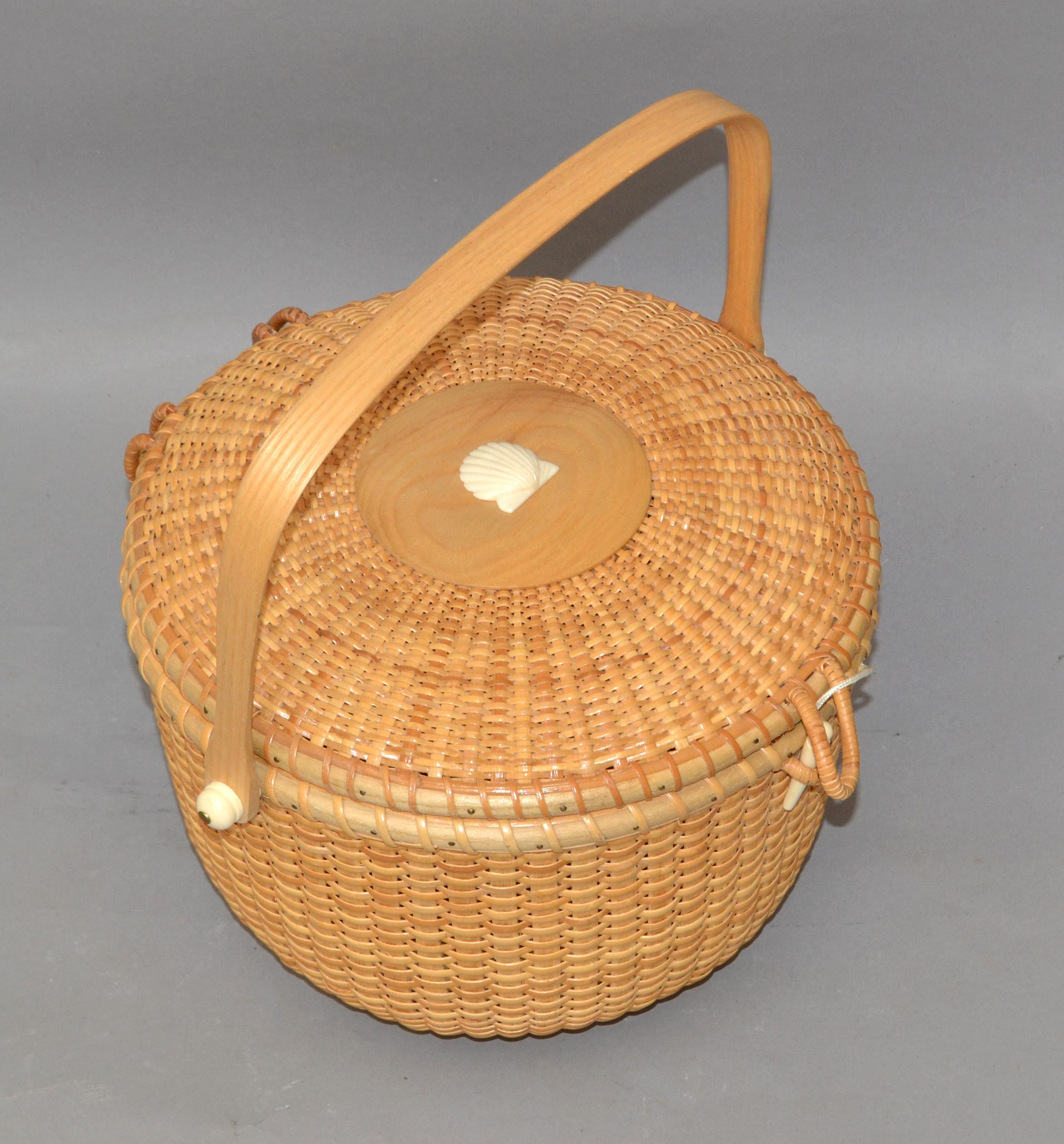 Vintage Coastal Folk Art lidded round basket handmade Bamboo and handwoven Rattan in blonde and white Plastik Seashell decoration. 
Nautical Bohemian Chic Design for Your bathroom, sunroom or as Centerpiece on a table setting.
