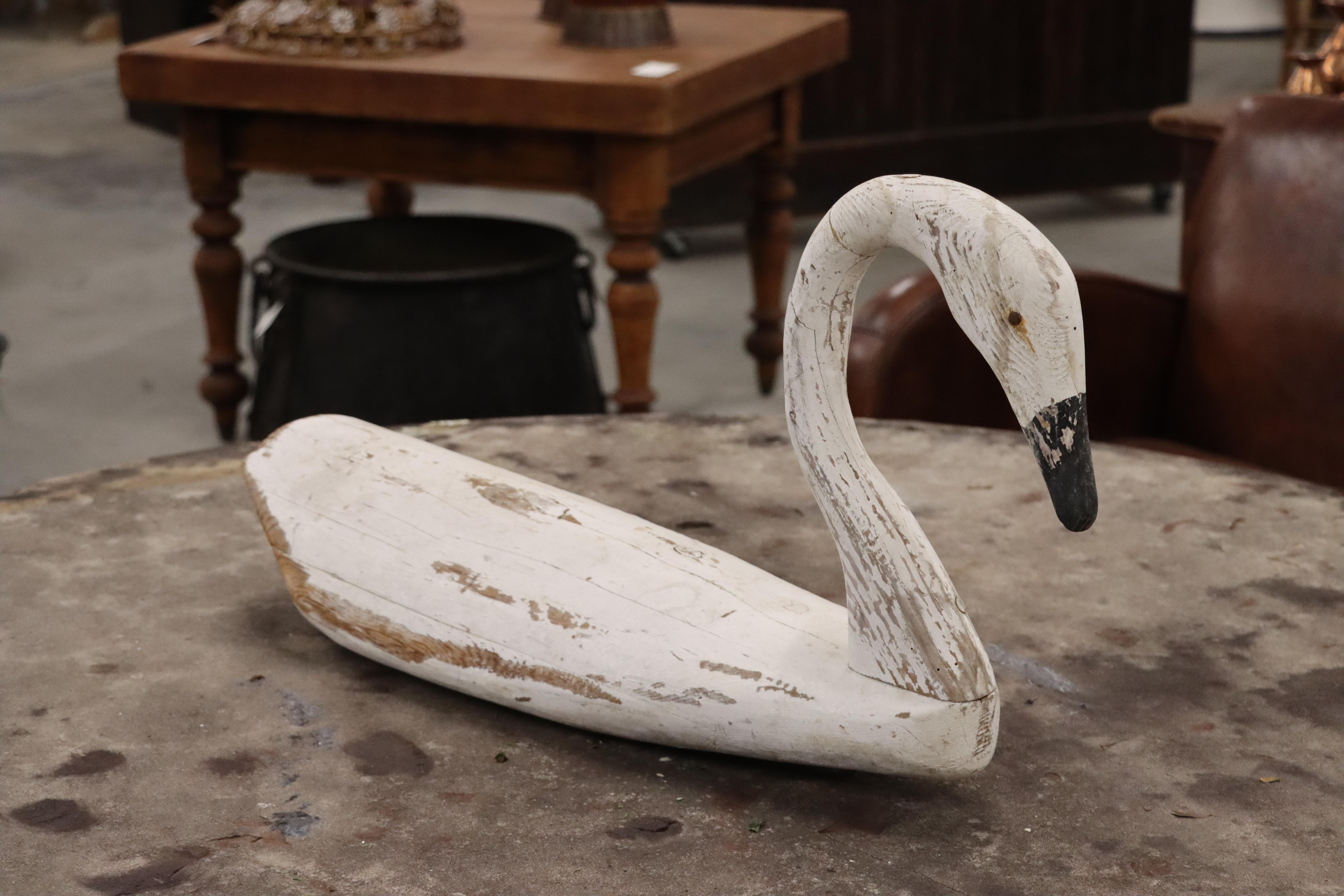 Graceful stylized circa 1940 life-size swan decoy with original distressed white paint. 

Wonderful sculptural art piece for a buffet or console table.