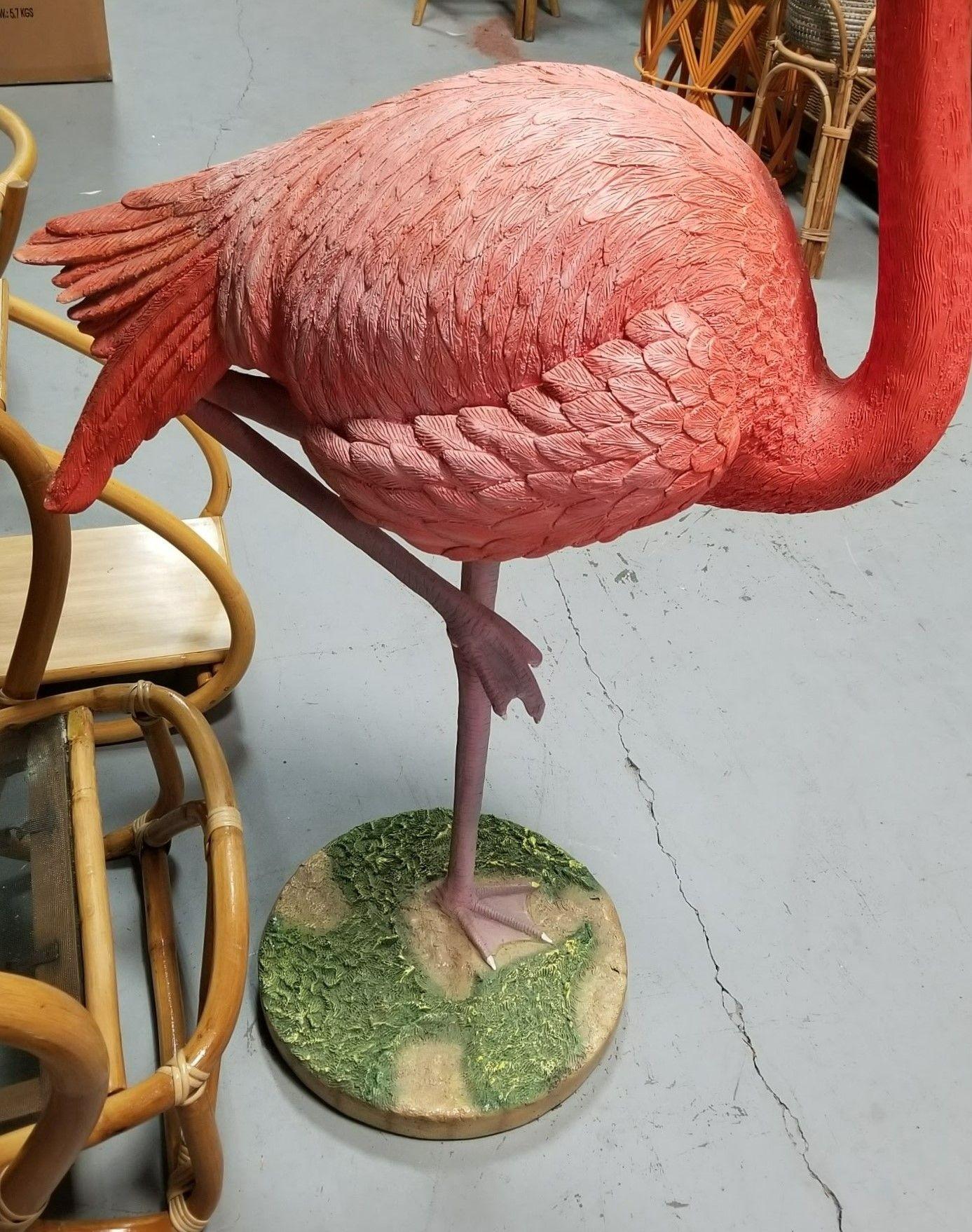 Vintage realistic life size pink flamingo on a patch of grass statue made of light weight fiberglass.

The Pink Flamingo Statue is a whimsical and charming piece that harkens back to the nostalgia of mid-century aesthetics. Crafted with attention to