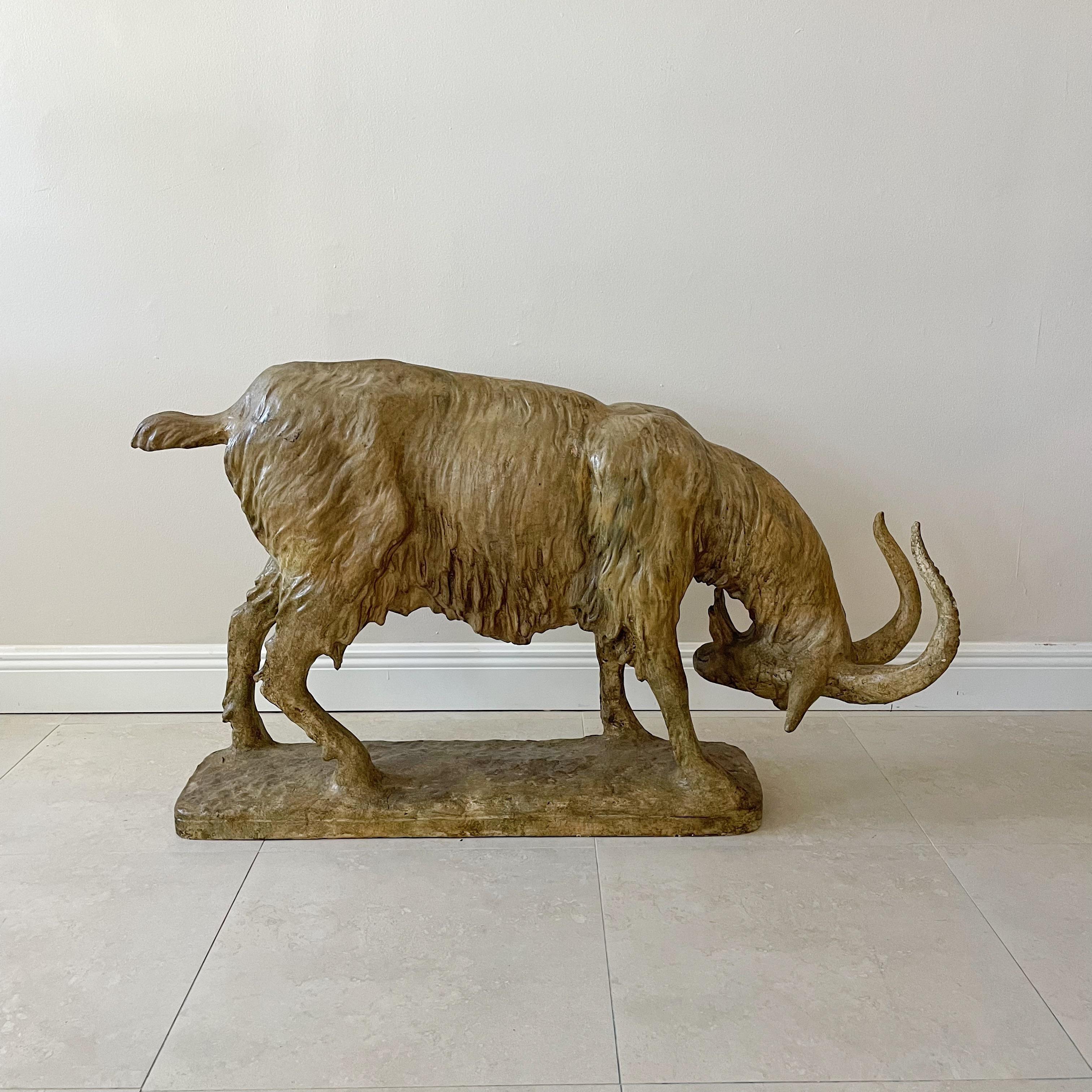 Realistic French Terracotta sculpture of a goat. Unsigned. Lifesize and fully restored to original finish. Structurally sound with no chips or breaks. Then base measures 36.5