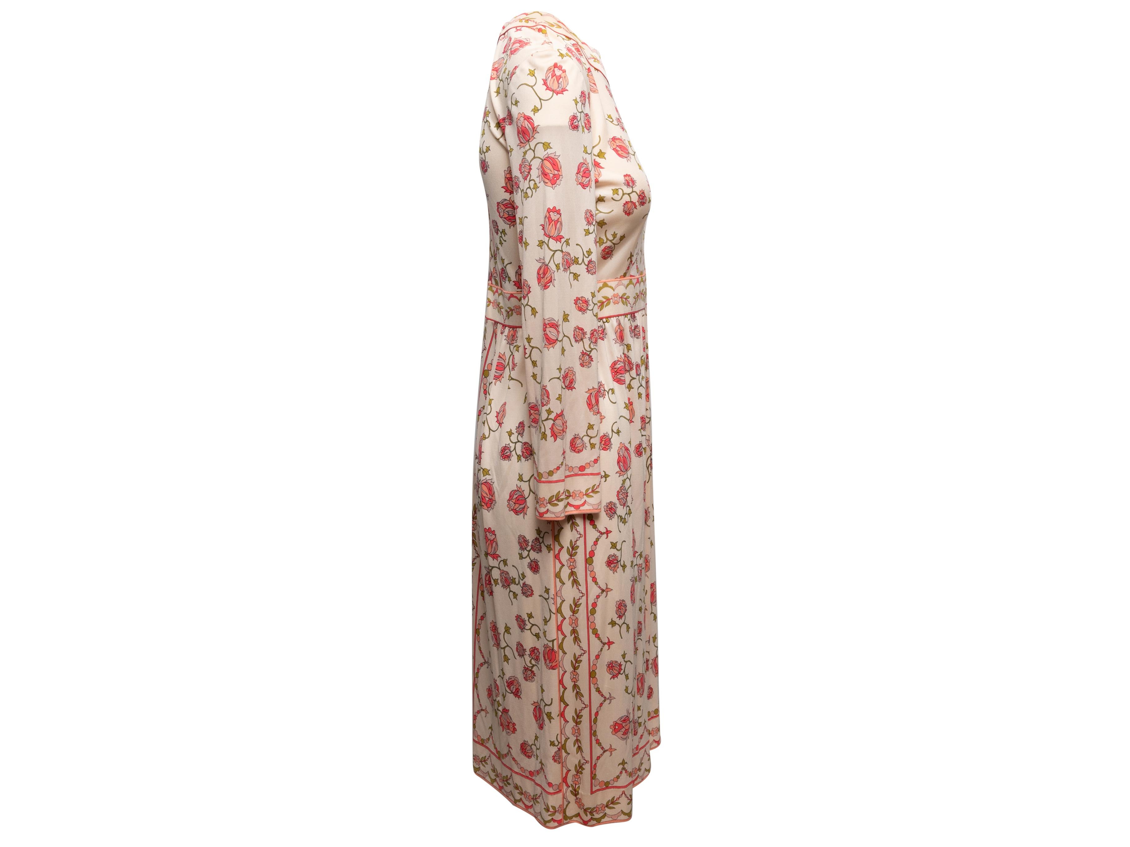 Vintage light pink and multicolor floral print dress by Emilio Pucci. Crew neck. Long sleeves. Zip closure at center back. 28