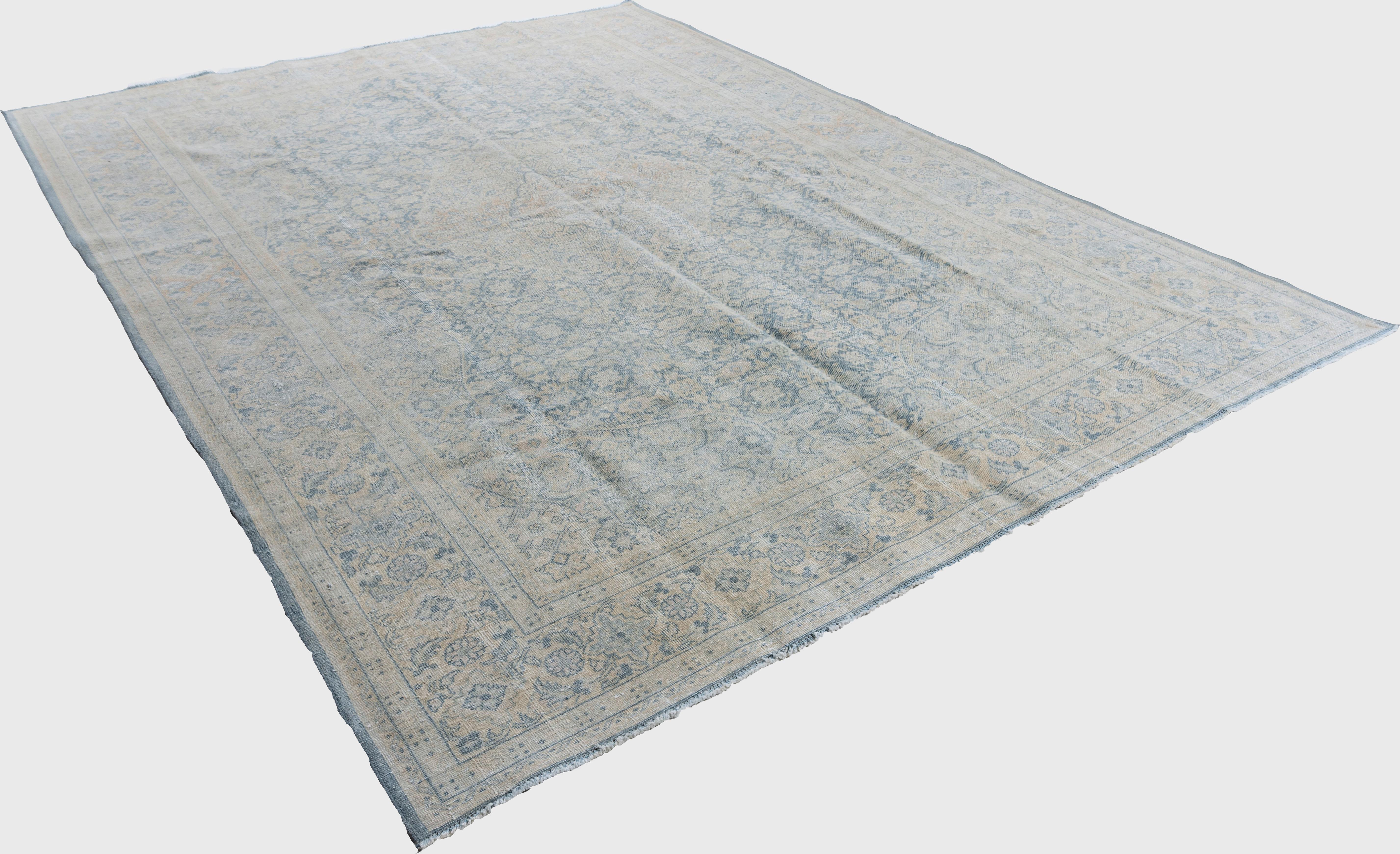Vintage Lightly Distressed Persian Tabriz rug 7'7 x 10'8. From Tabriz in Persia this is a classic vintage piece that will enhance any room setting. A distressed carpet is not an abused one, but one that has been artfully recreated to follow current