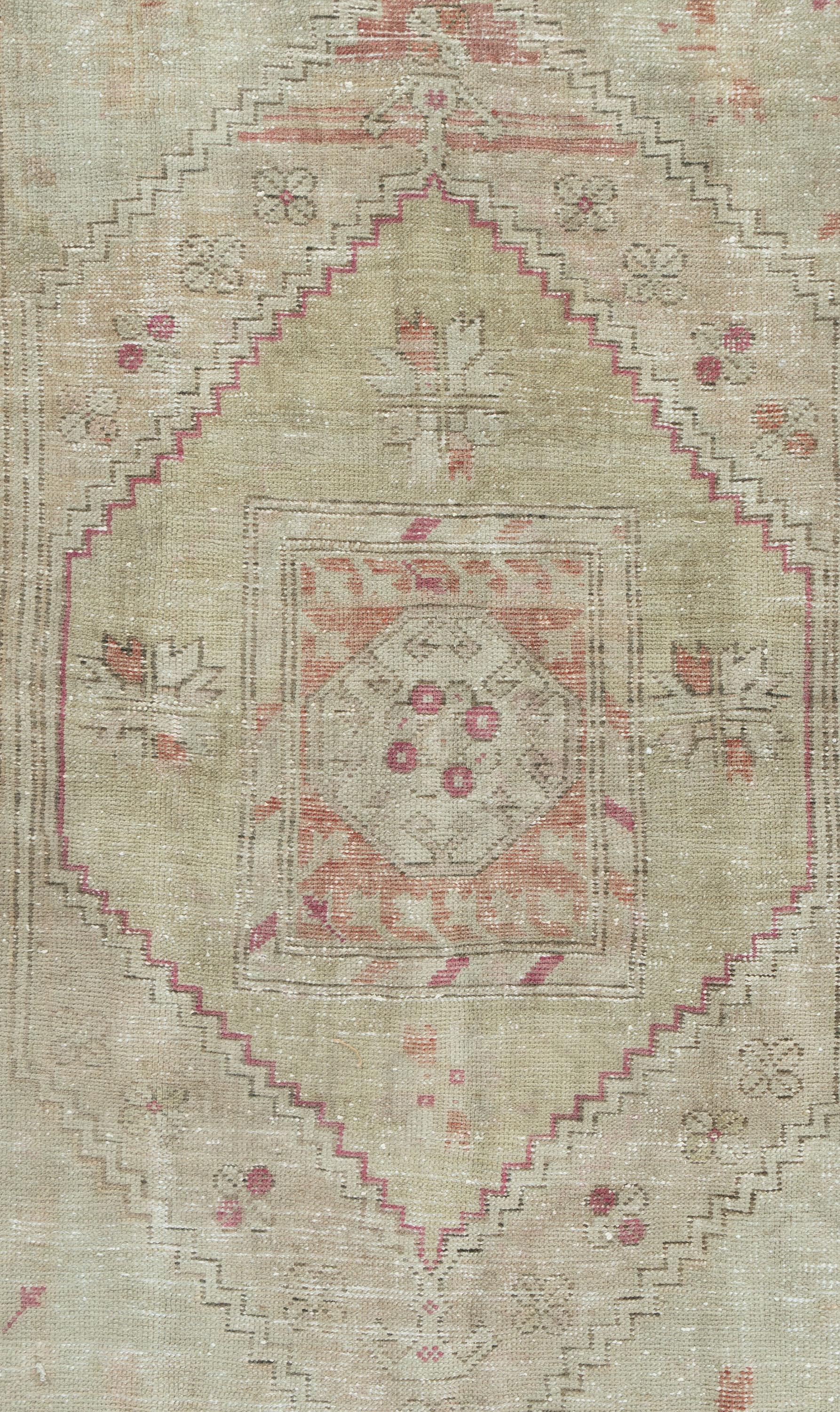 Vintage Lightly Distressed Turkish Anatolian Rug 5'4 x 8'1.  Character, tradition, pattern and palette converge in this gorgeous vintage hand knotted Turkish rug, woven in the small west-central Anatolian region. The rug-weaving is in west-central