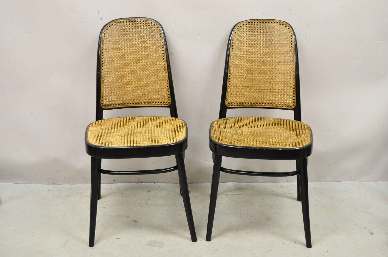 Vintage Ligna Bentwood Black Ebonized Cane Bistro Side Chairs - a Pair. The item features the original label, cane seat/back, tapered legs, very nice vintage pair, great style and form. Circa Mid 20th Century. Measurements: 36