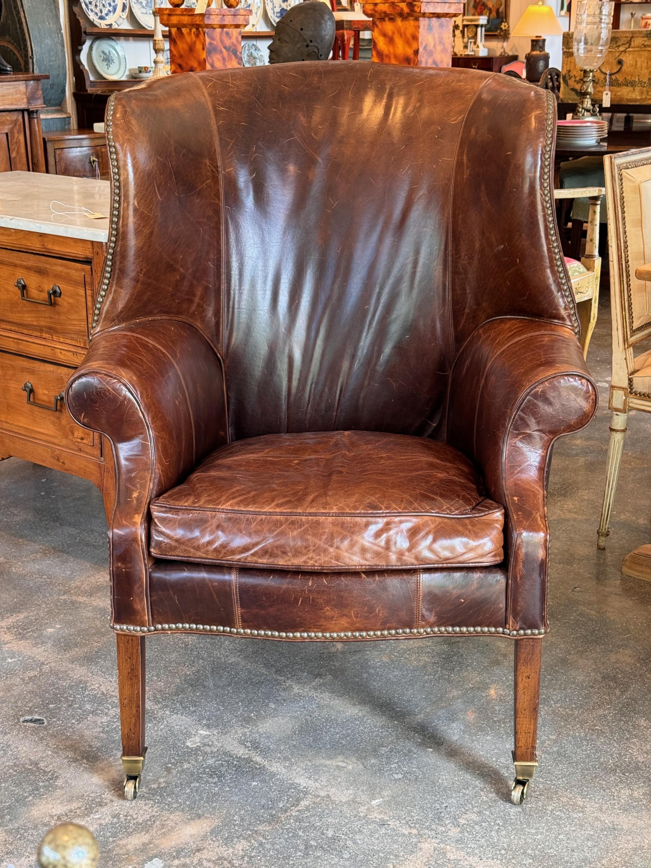 A big and comfortable leather wingback chair. Great style and color.