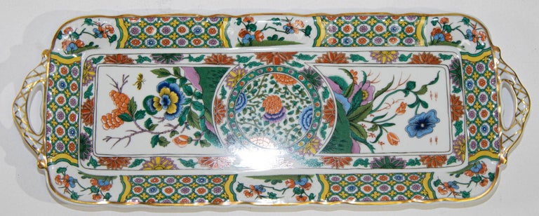 Limoges Bernardaud Asian Imari pattern porcelain rectangular cake plate.
Limoges porcelain tray with handles hand-painted with flowers and garlands in an Asian Japanese Imari inspired design, gilding all around the edges.
Vintage beautiful Limoges