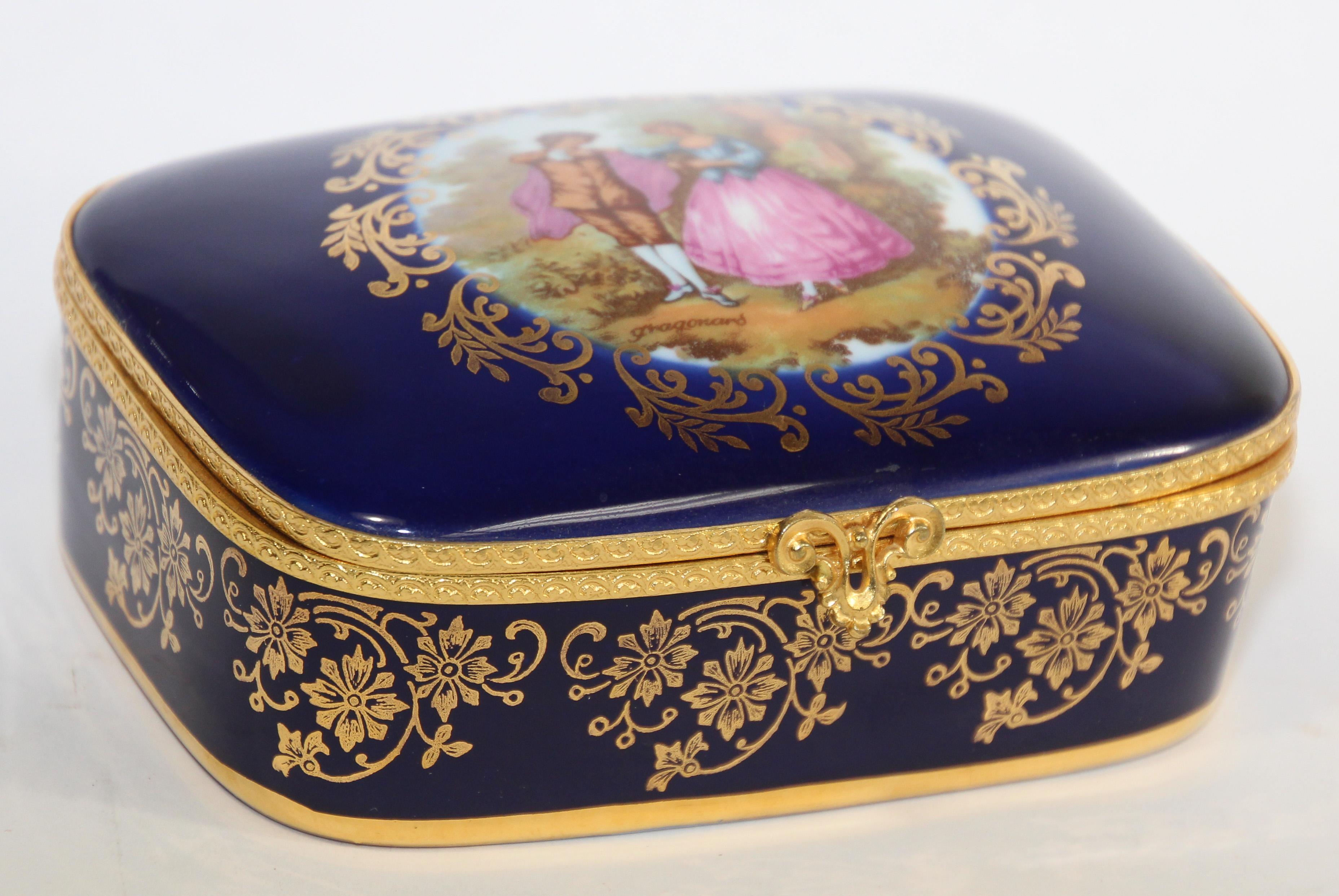 Elegant vintage Limoges 22-karat gold trinket jewellery box.
French vintage Limoges trinket box in cobalt royal blue with fine gold trim. 
Marked on base as “Limoges France Veritable Porcelain D' Art ”.
Hand-made porcelain in Limoges France. Circa