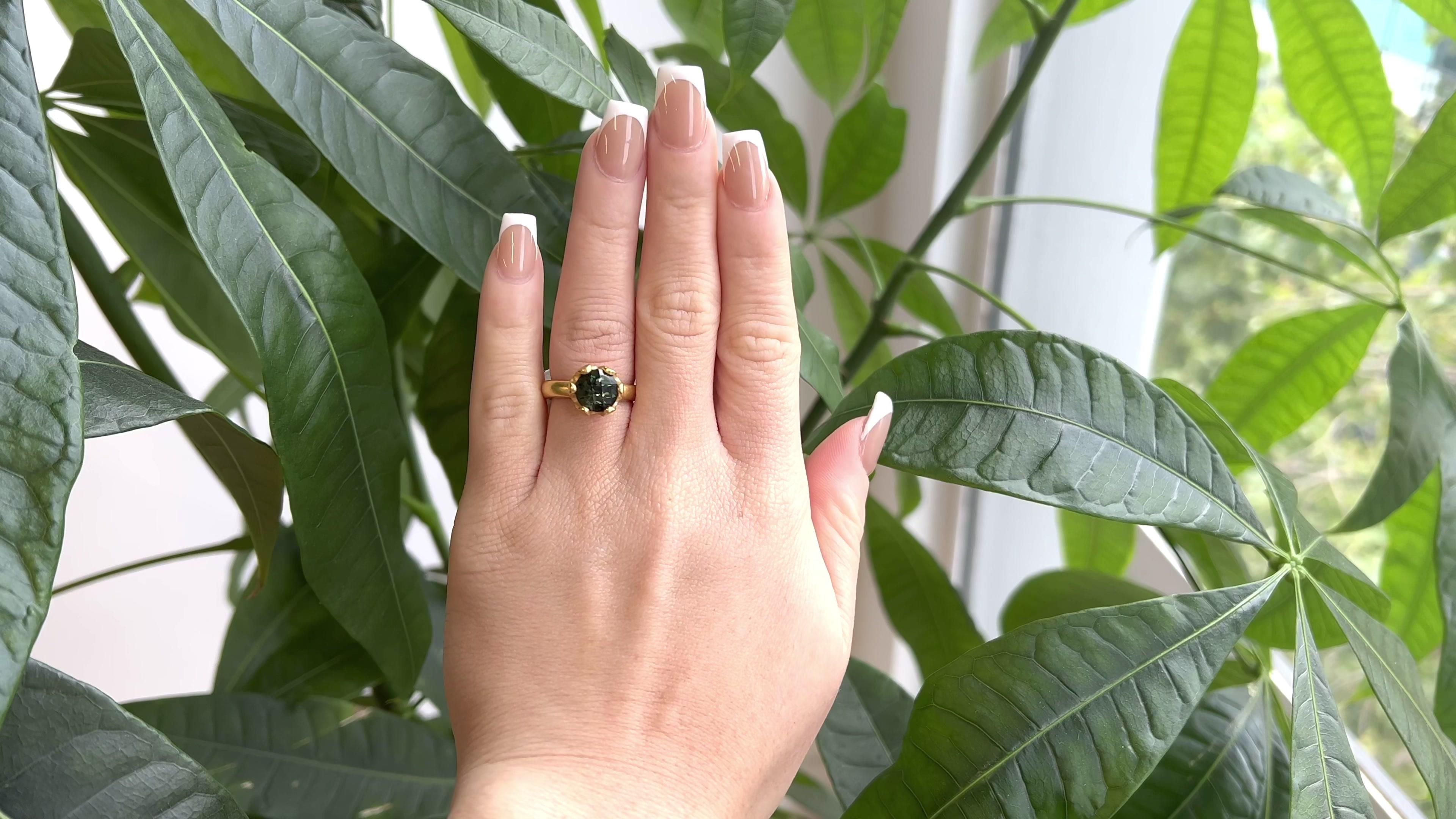One Vintage Linda Lee Johnson Green Stone 21 Karat Gold Ring. Featuring one round green tourmaline. Crafted in 21 karat yellow gold, with Linda Lee Johnson maker's mark and purity mark. Circa 1990s. The ring is a size 6 3/4. 

About this Item: