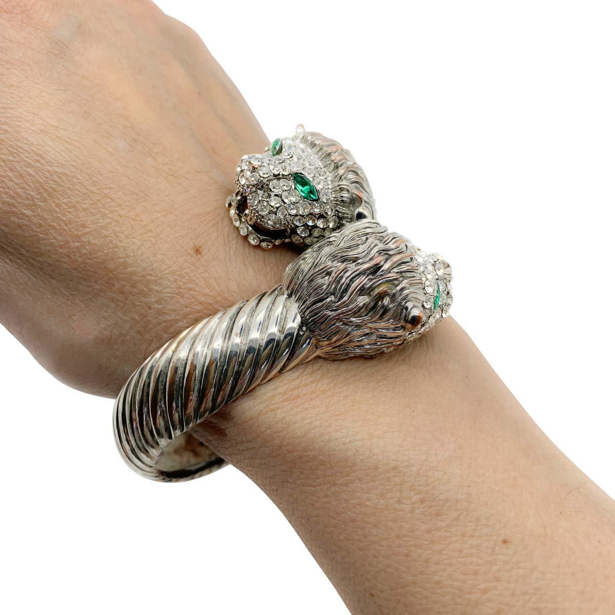 A fabulously ferocious vintage Lion clamper bracelet. Featuring a double header of Lions embellished with crystal stones and piercing green marquise crystal eyes.

Vintage Condition: Very good overall with very light age-appropriate wear or