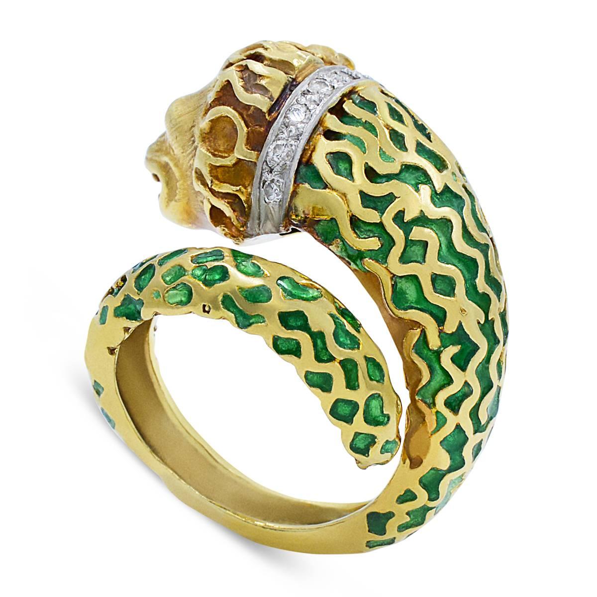 Presented here is an outstanding sculptural by-pass Lion ring in 18K Gold with Green Enamel and Diamonds from the 1960s. 

The quality and workmanship is very detailed and he is an exceptionally handsome lion. The face, so very fine, you can see the
