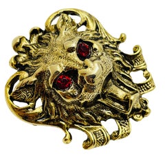 Vintage lion gold tone ruby red eyes designer brooch
