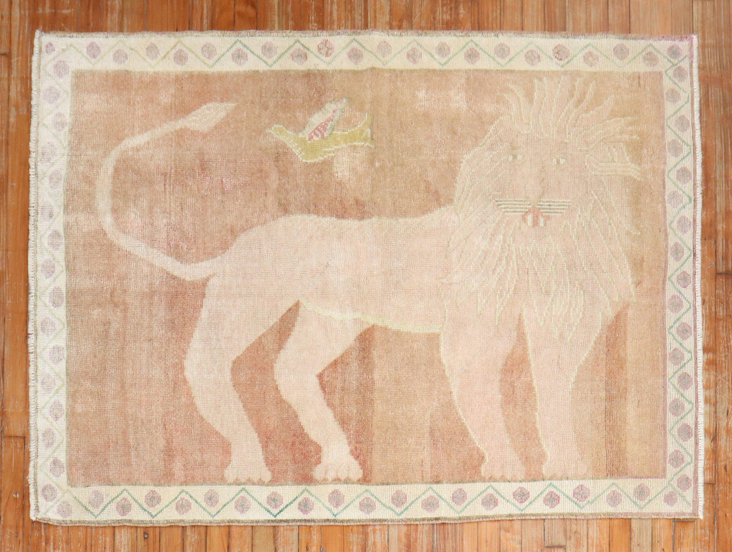 a 3rd quarter of the 20th century Turkish Anatolian rug with a happy go lucky lion set on a light brown field

Measures: 4'2'' x 5'9''.