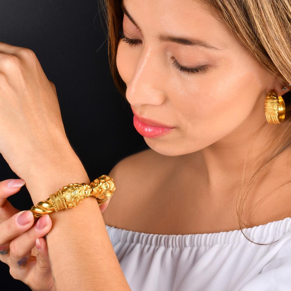 Perfect for Gold lovers or Leo and anyone who admires the lion artistry. This hefty  vintage 22k yellow Gold

Double Lion’s Head Cuff Bangle Bracelet is crafted in 22-karat yellow gold with many hand-crafted detailed works all around this stunning
