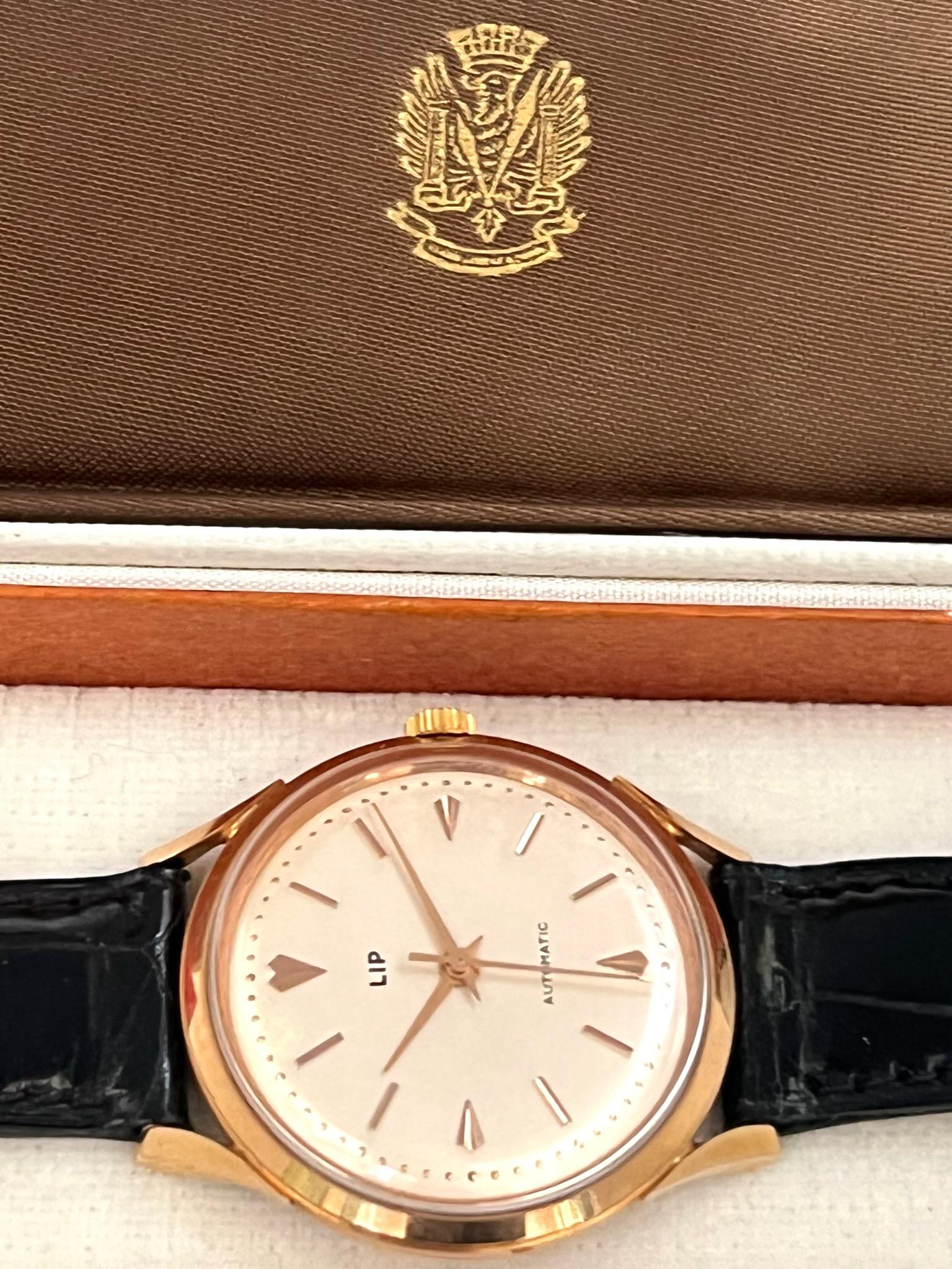 The Lip 18 Carat Gold Automatic wristwatch. Beautiful rose gold case with screw down case back. Gold applied markers to the cream dial, gold daphne hands.

Swiss 21 Jewelled automatic movement with Swiss lever escapement. Original crocodile strap