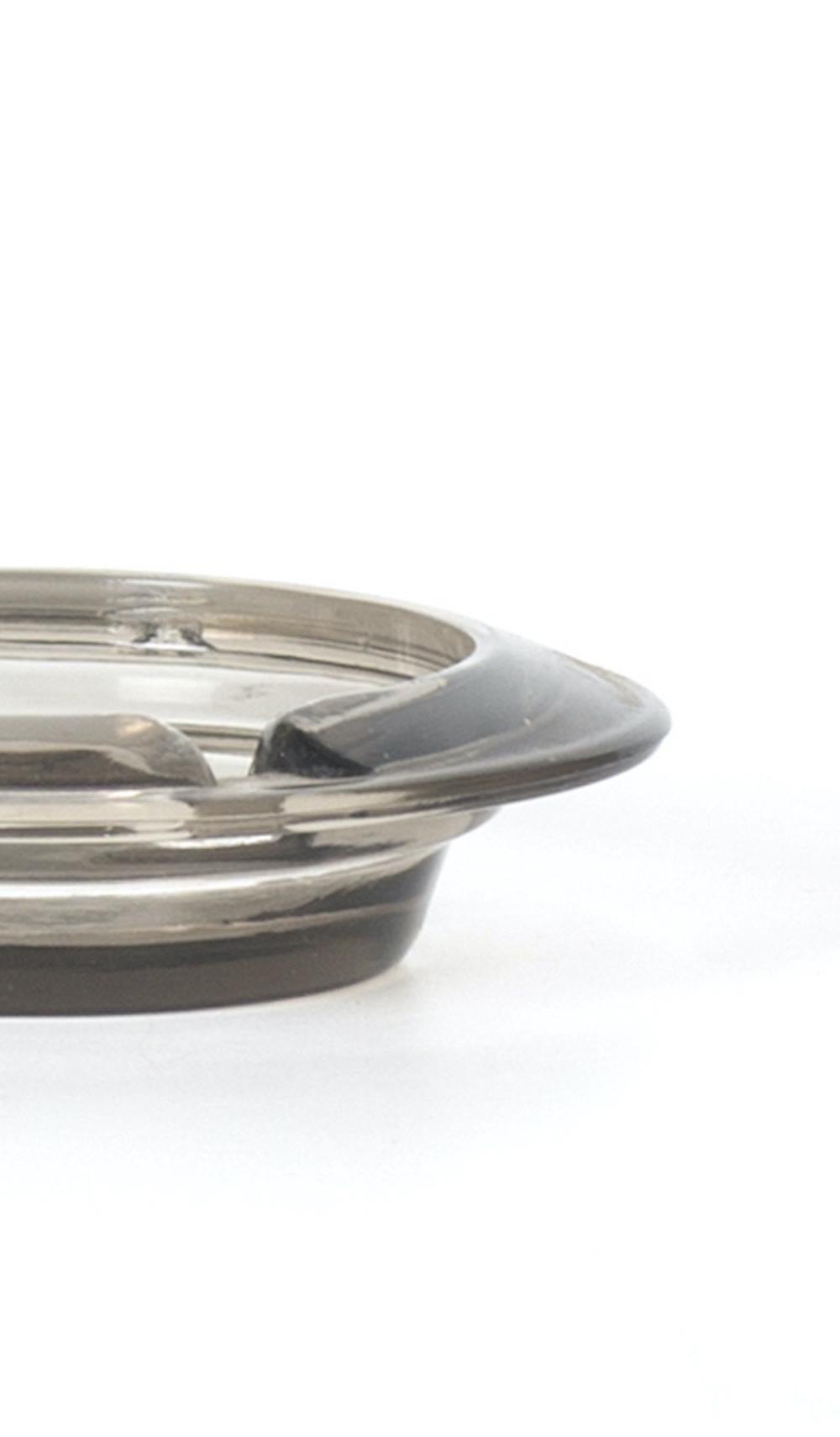 Vintage little glass ashtray is an elegant glass decorative object, realized during the 1970s. 

Glass little ashtray perfect for your home.