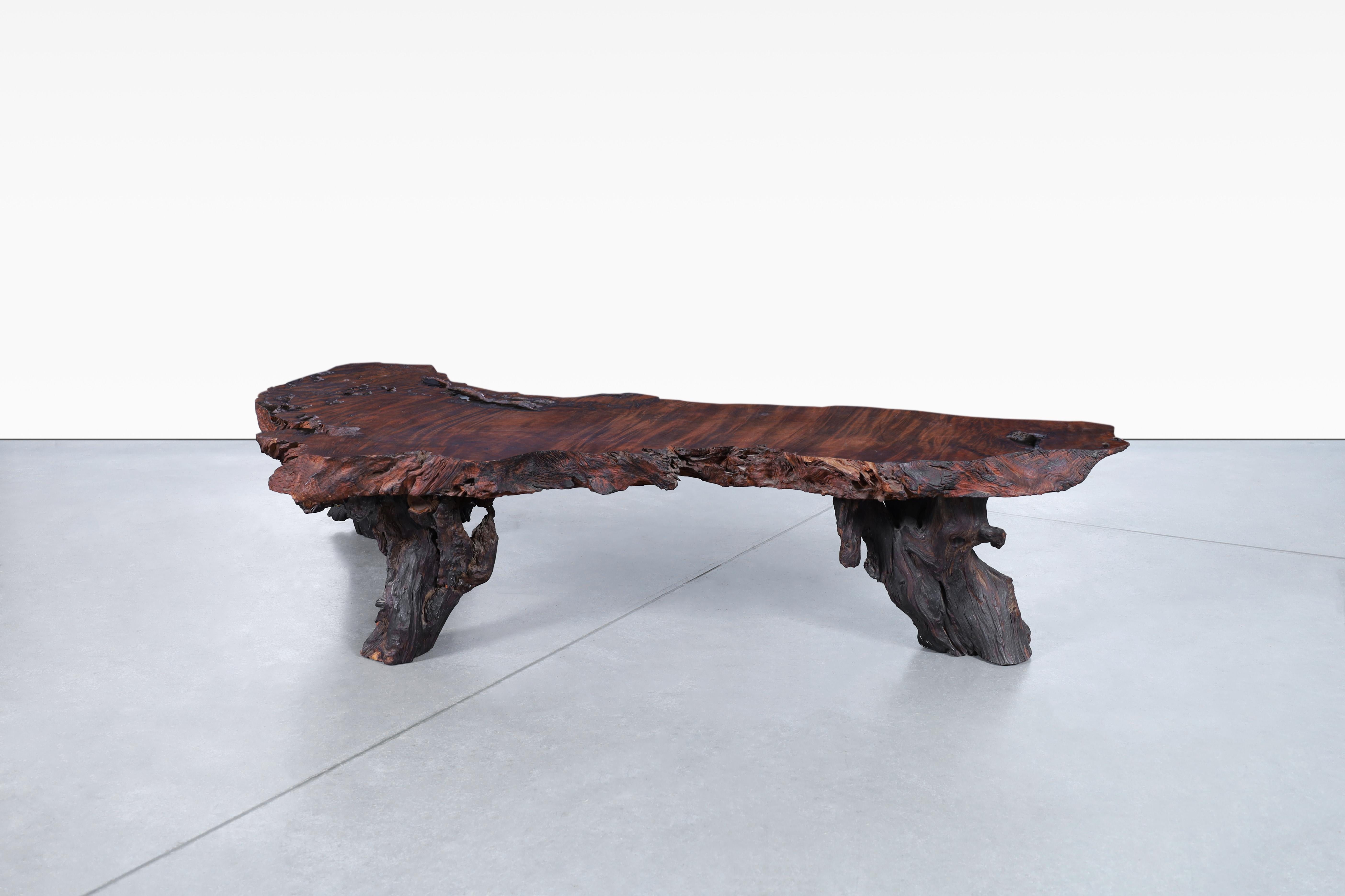 Beautiful vintage live edge redwood burl coffee table, designed in the United States, circa 1960s. This breathtaking redwood table is a one-of-a-kind masterpiece, handcrafted to perfection. The live edge design captures the raw, unrefined essence of