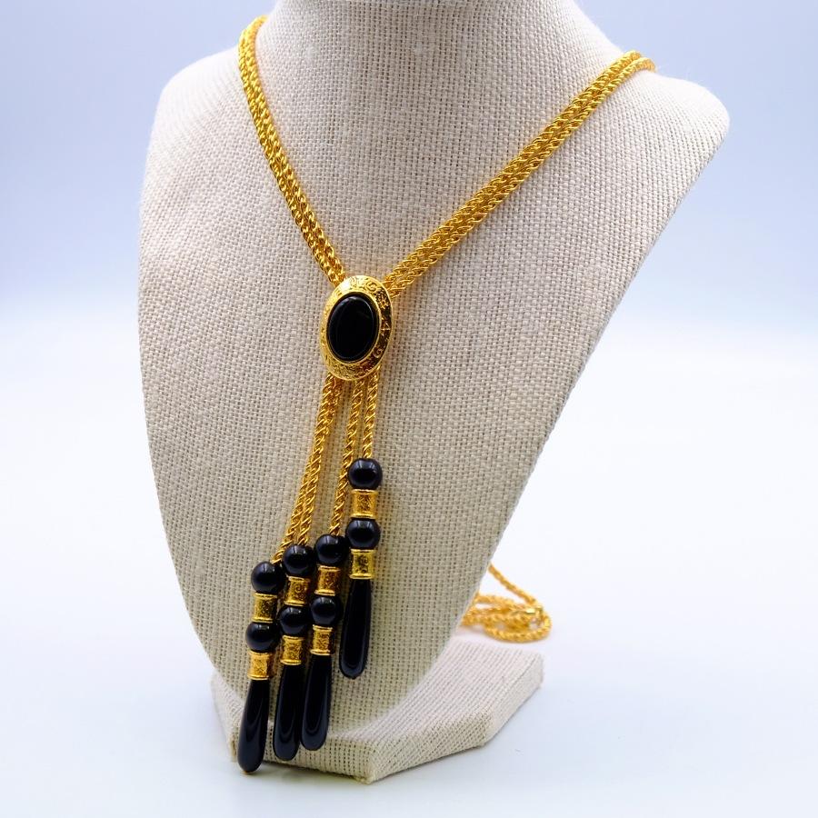 Year: 2000
Hallmark: LC
Dimensions: chain L 30.70 in, pendant H 5.70 in
Materials: base metal, plastic, faux onyx
