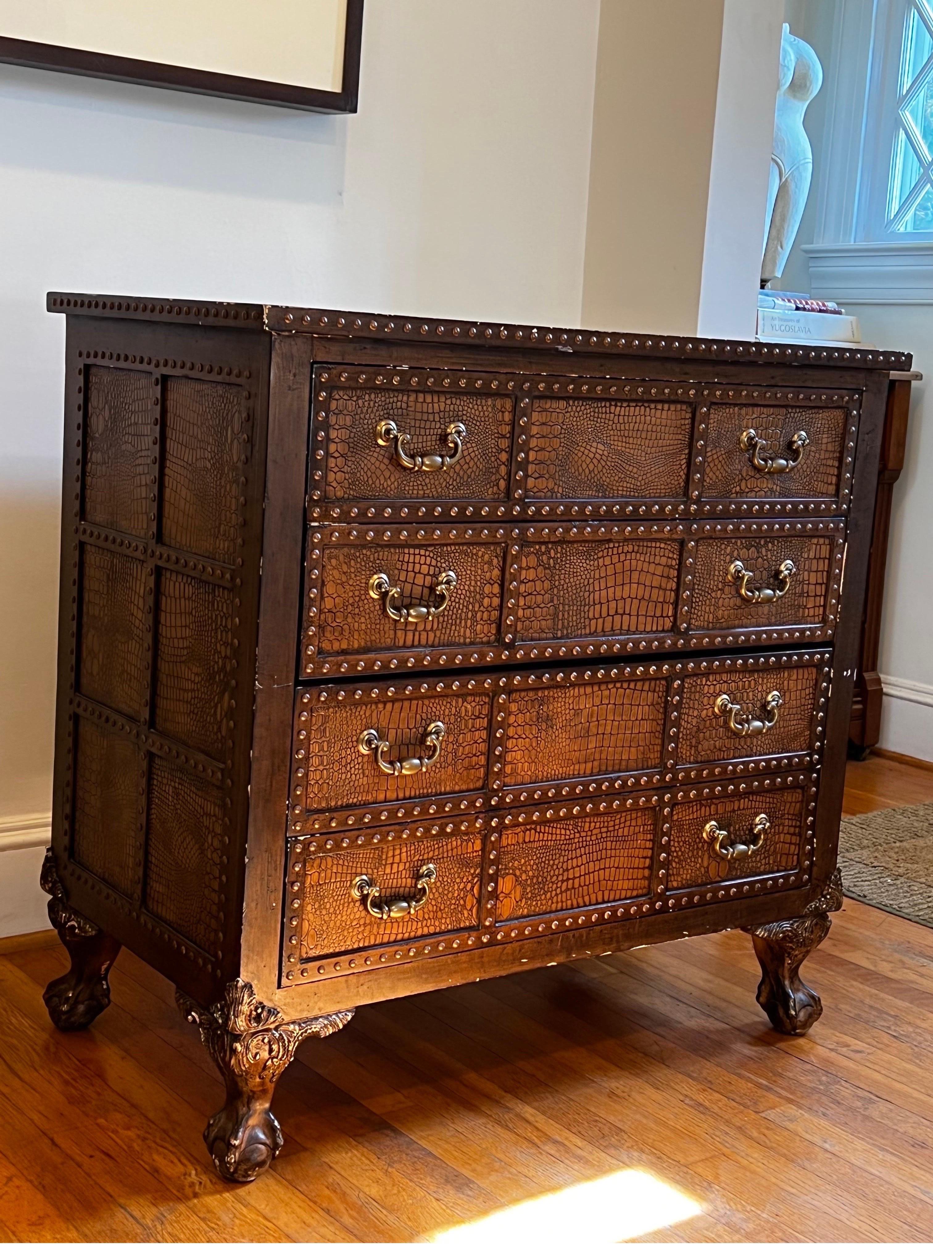 Custom Reptile skin dresser/commode with 4 drawers. Designed in France.
Brass stud details and carved legs. Brass hardware.

Made in Italy paper lining inside each drawer. 

