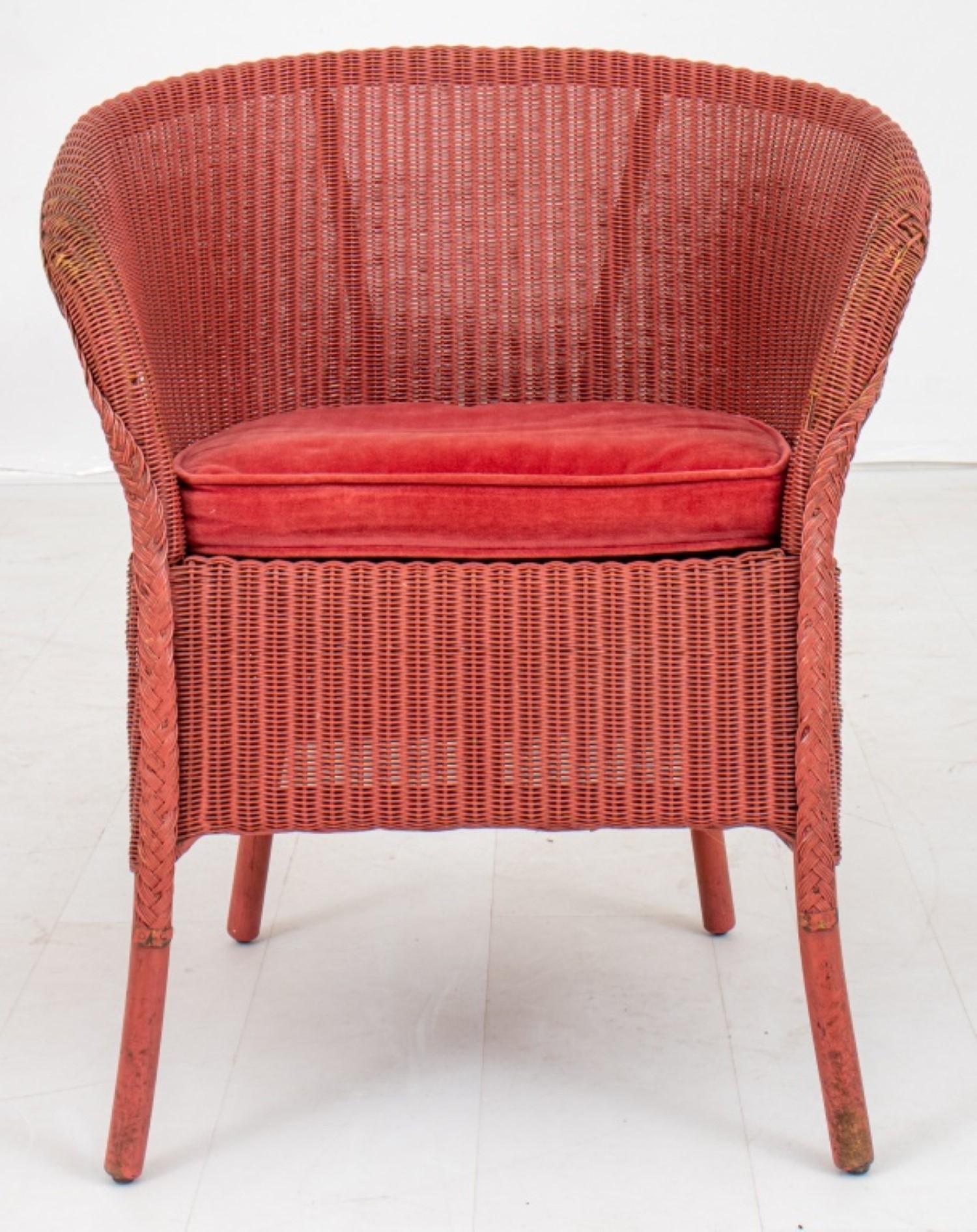 Vintage Lloyd Loom 'Beverly' woven wicker tub  chair in red, with rounded back and sides,  on four legs, with label to underside.Dimensions28.4 H x 24 L x 16D inches 