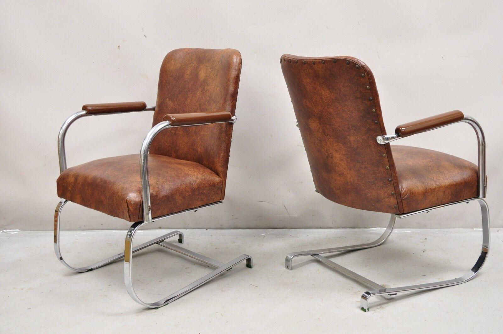 Vintage Lloyd Mfg Kem Weber Art Deco Steel Cantilever Lounge Chairs - a Pair. Item features a steel flat bar cantilever frames, brown naugahyde upholstery, original label, very nice antique/vintage chairs. Circa 1930s. Measurements: 33