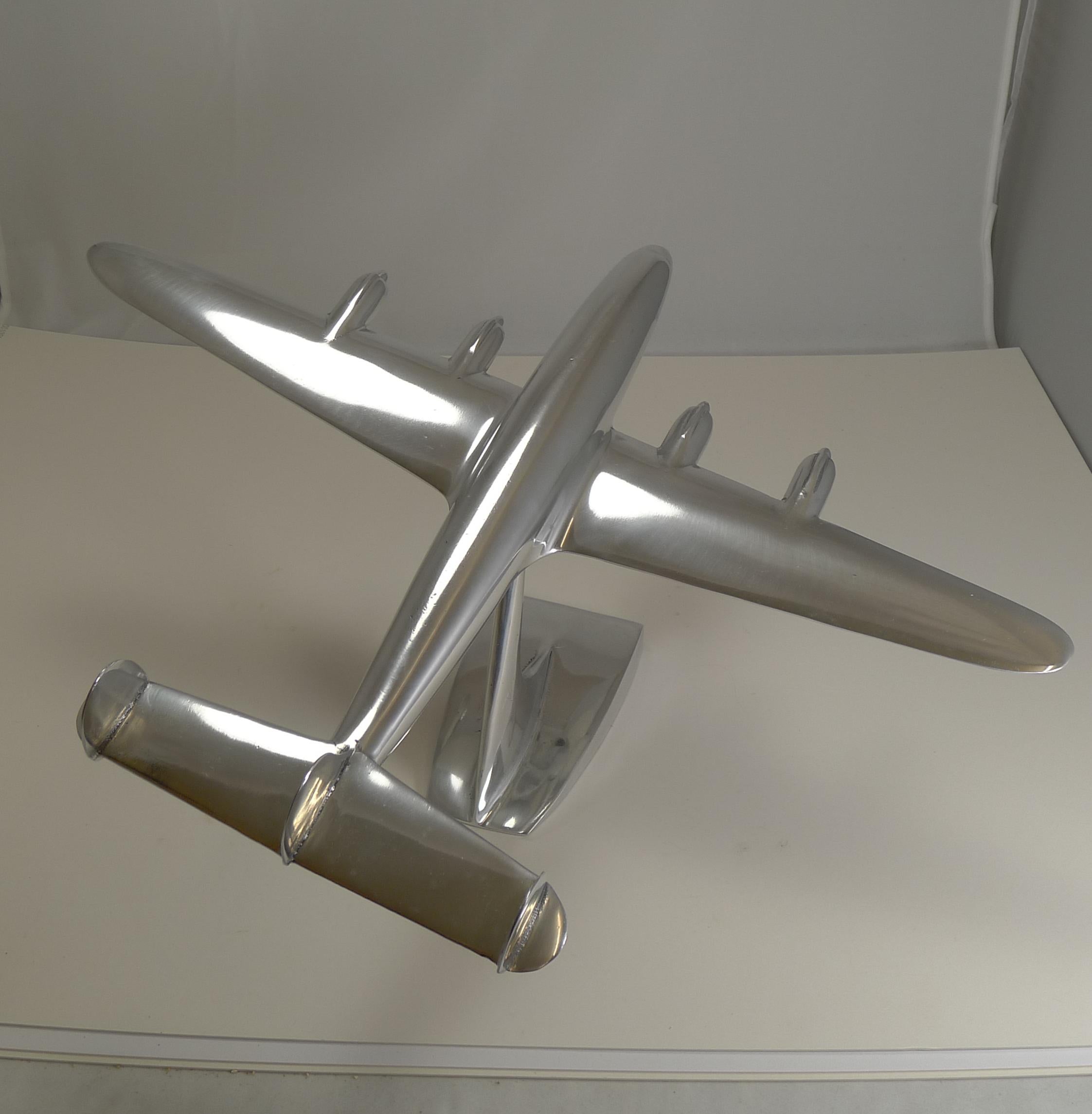 A handsome and highly collectable polished aluminium aircraft model on a stand.

The Lockheed Constellation (